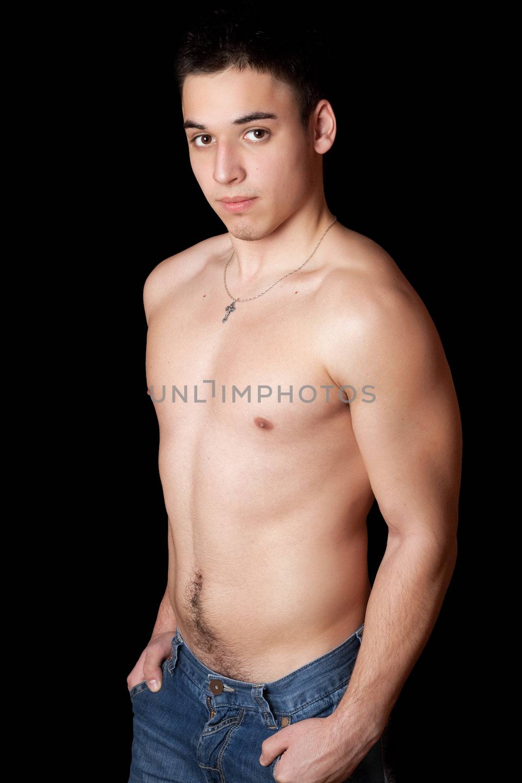 Portrait of attractive young man. Isolated on black