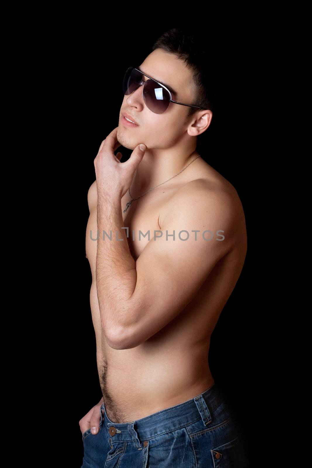 Portrait of young man in sunglasses. Isolated