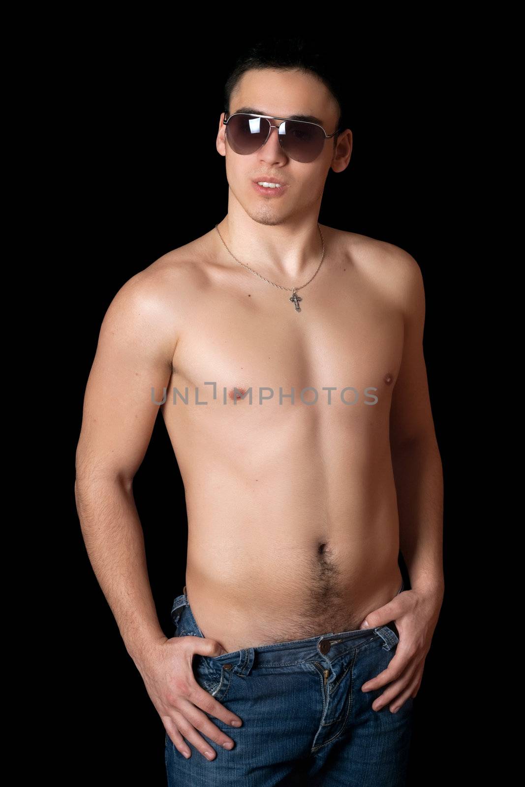 Portrait of handsome young man in sunglasses. Isolated
