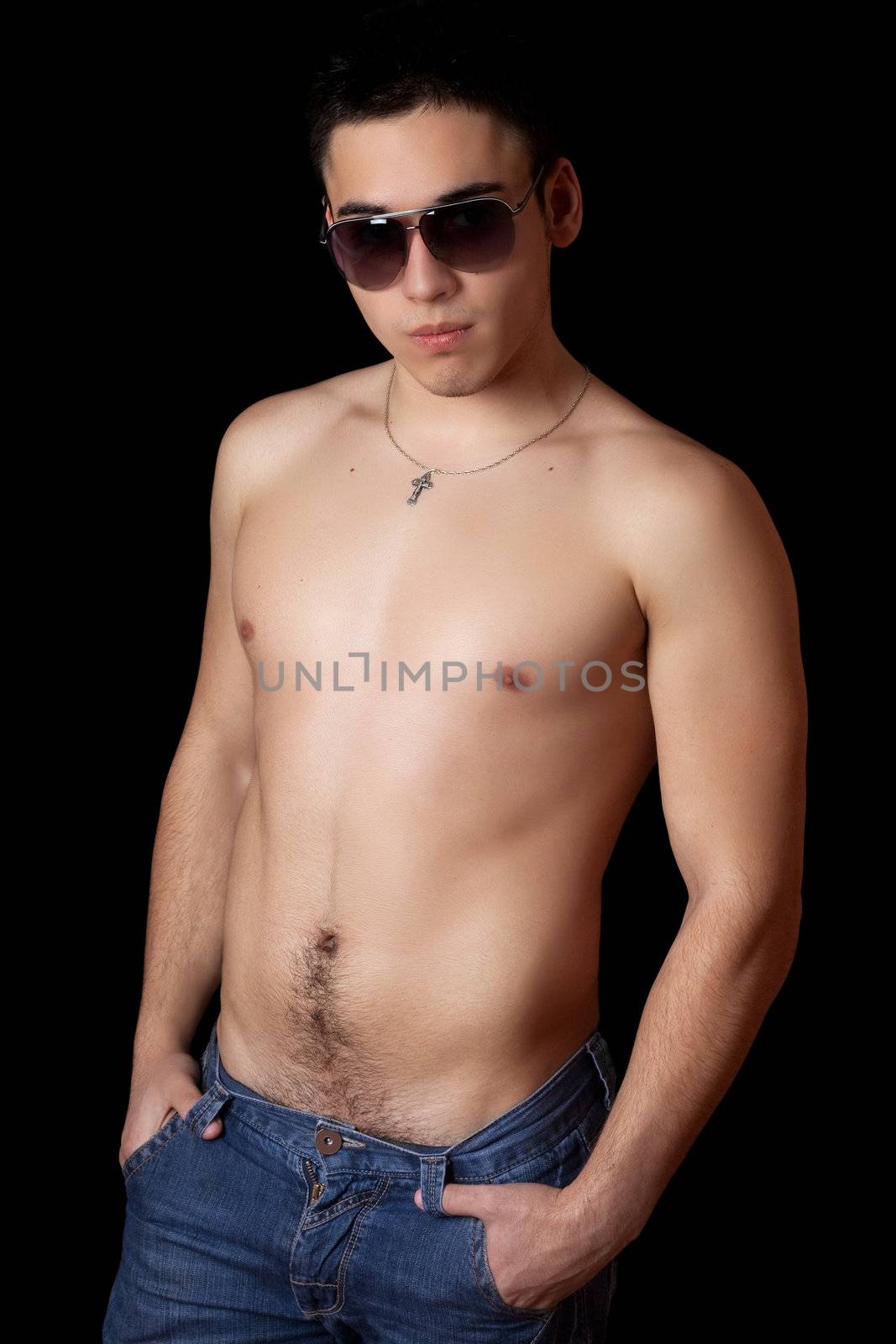 Young man in sunglasses. Isolated on black background
