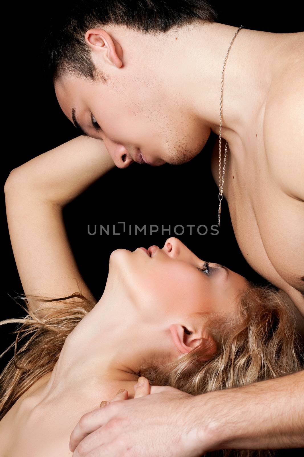 Portrait of a passionate beautiful young couple. Isolated