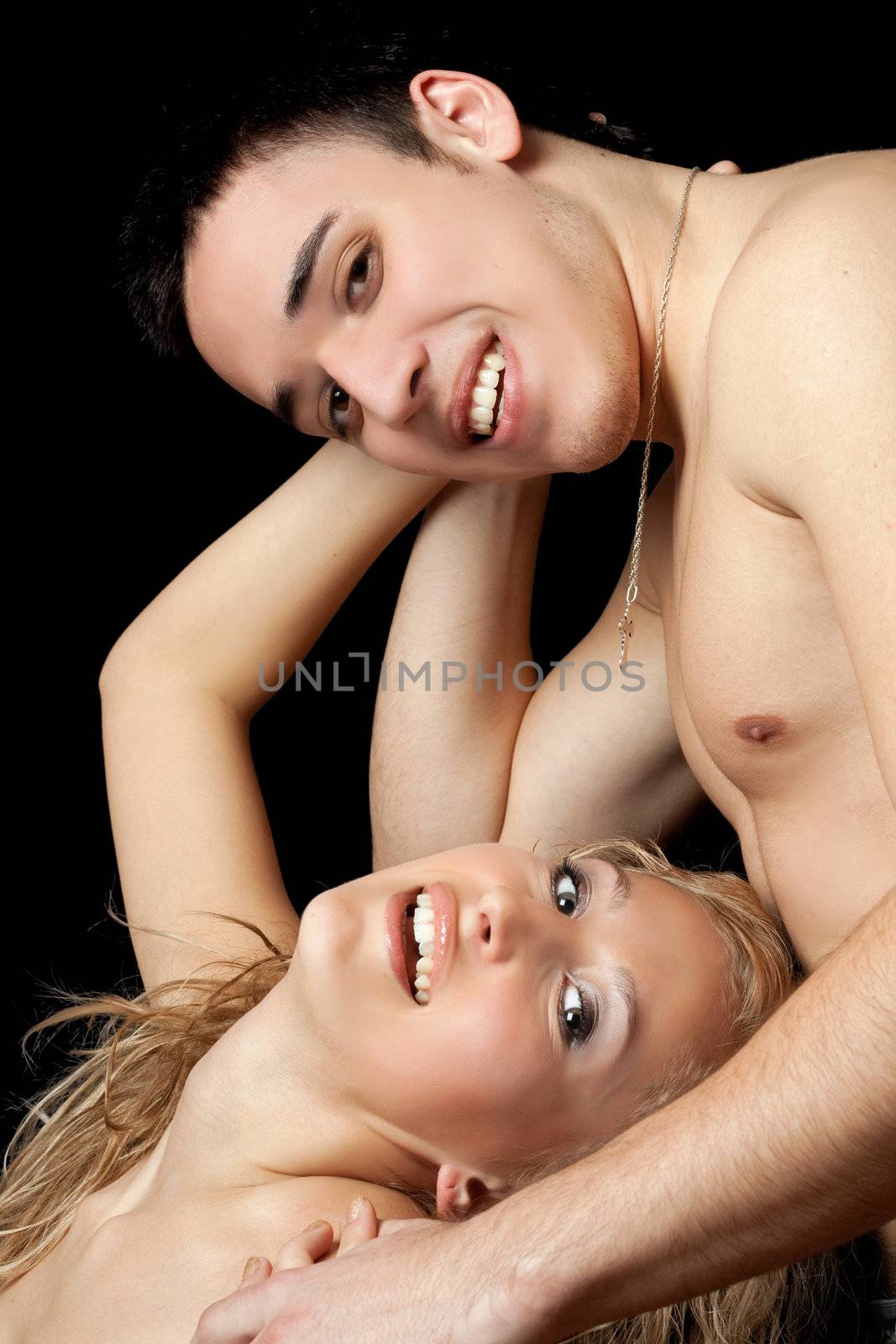 Portrait of a smiling young couple. Isolated