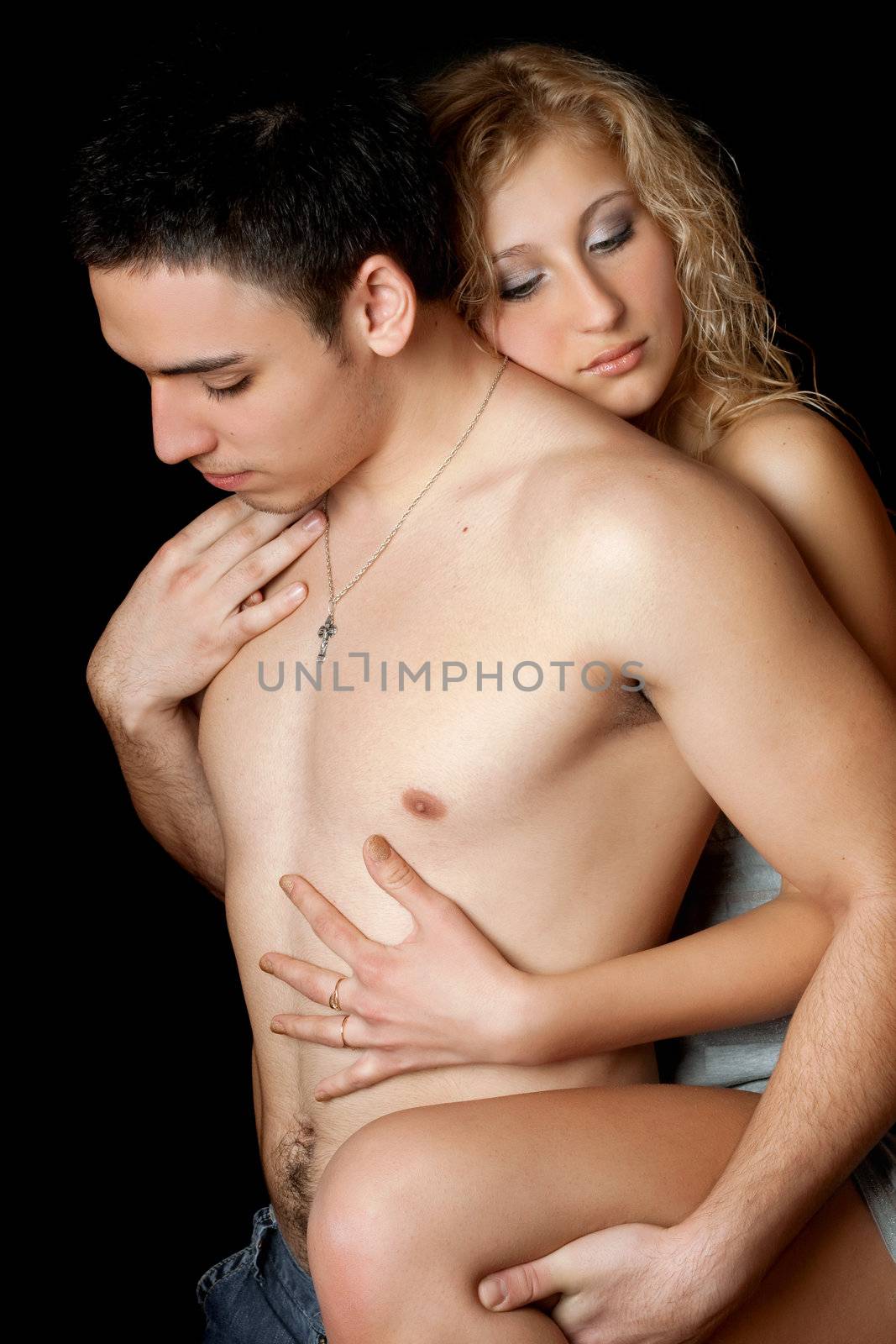 Portrait of attractive loving young couple. Isolated