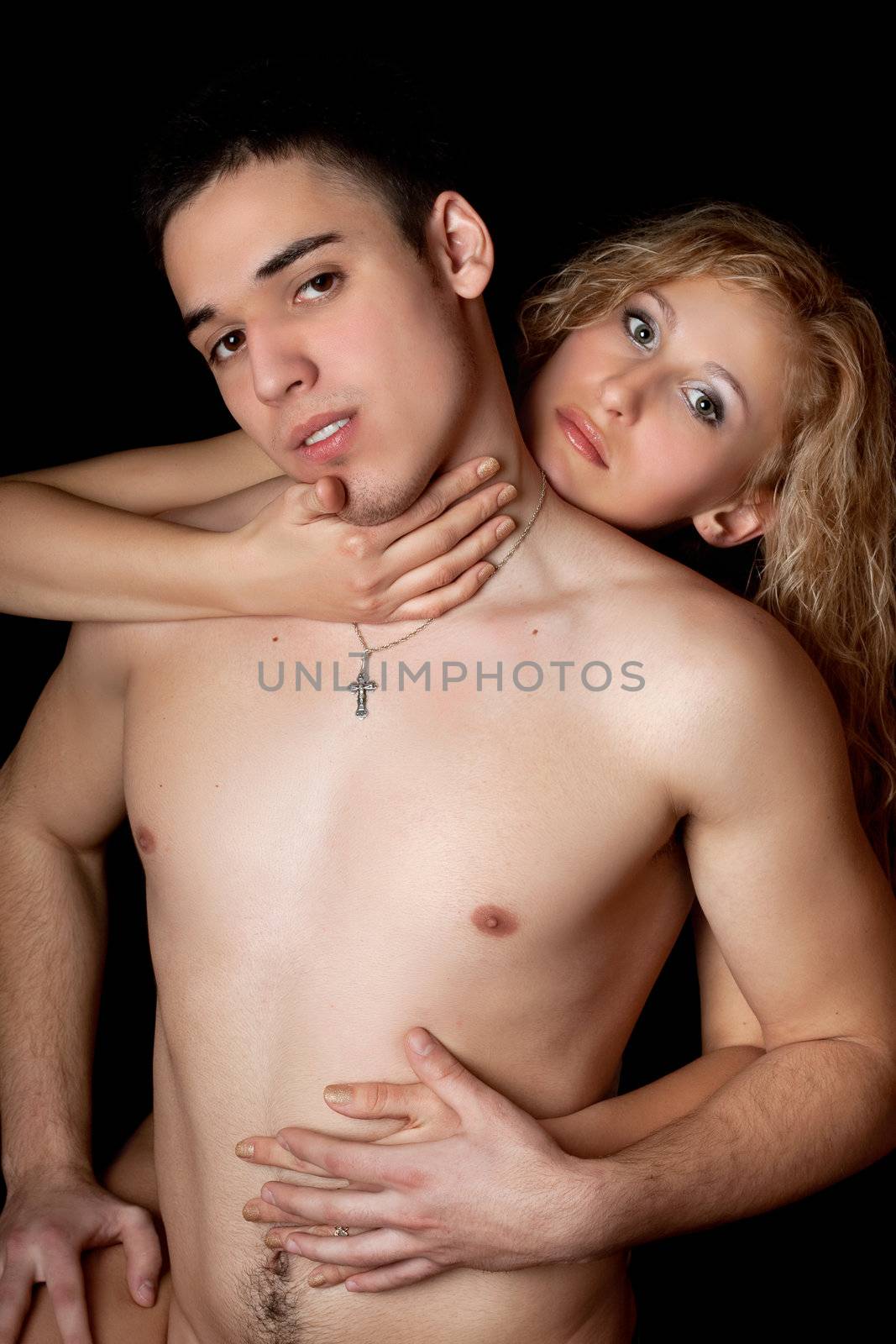Beautiful young couple. Isolated on black background