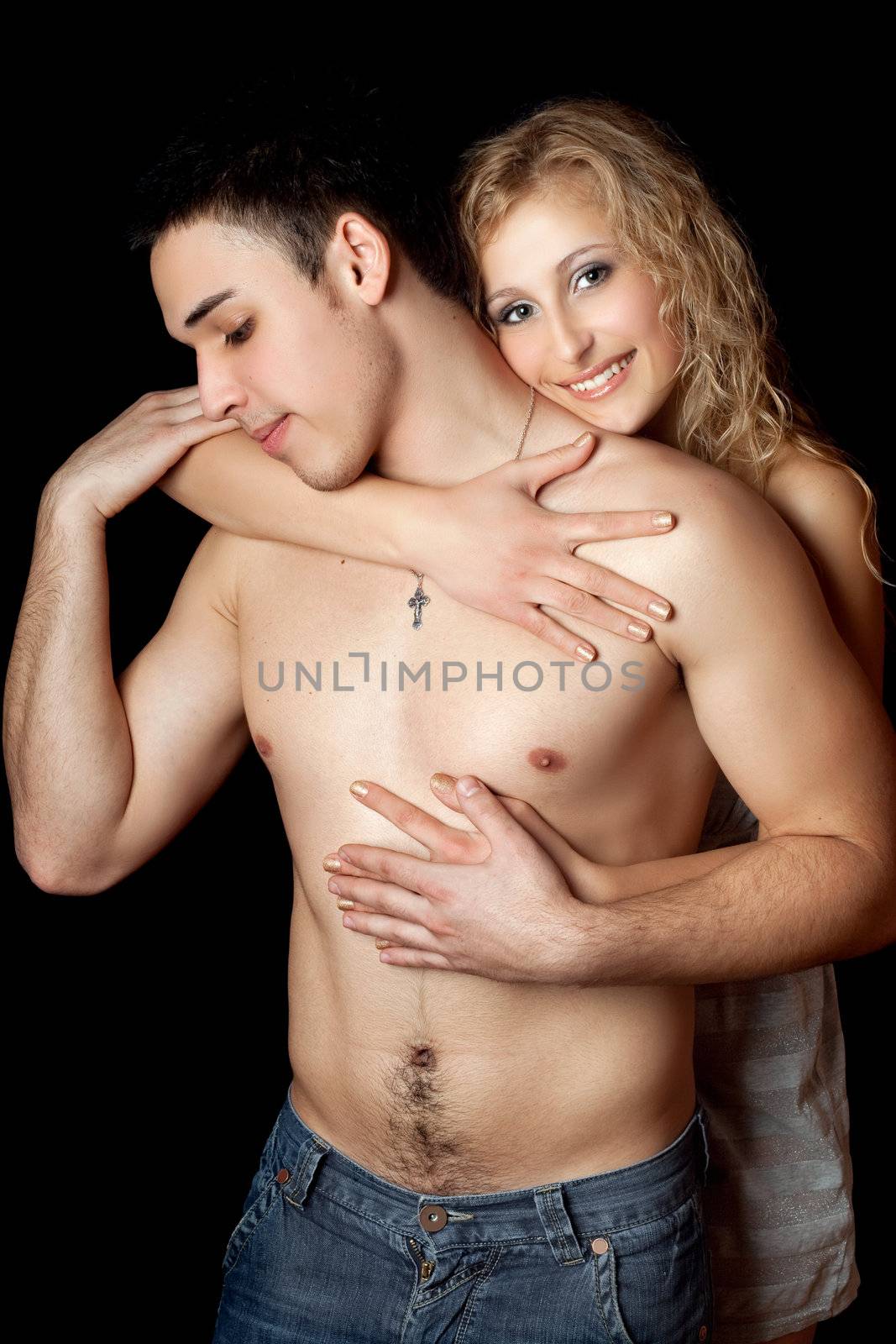 Portrait of happy loving young couple. Isolated