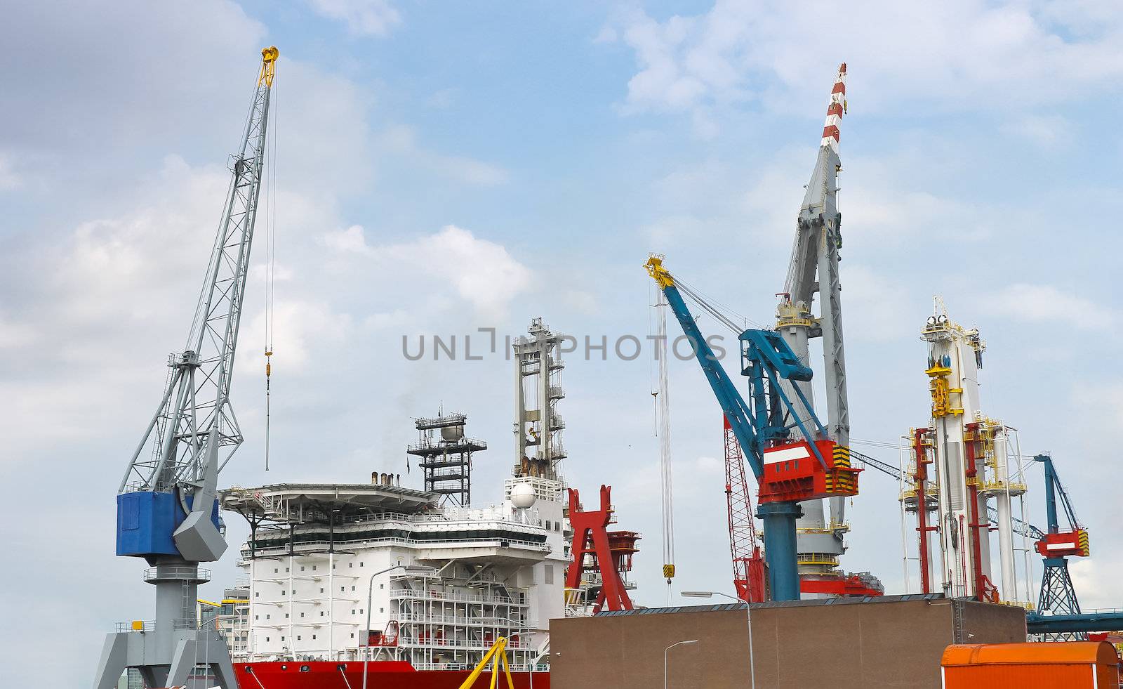 Industrial landscape. Ship and crane in shipyard by NickNick
