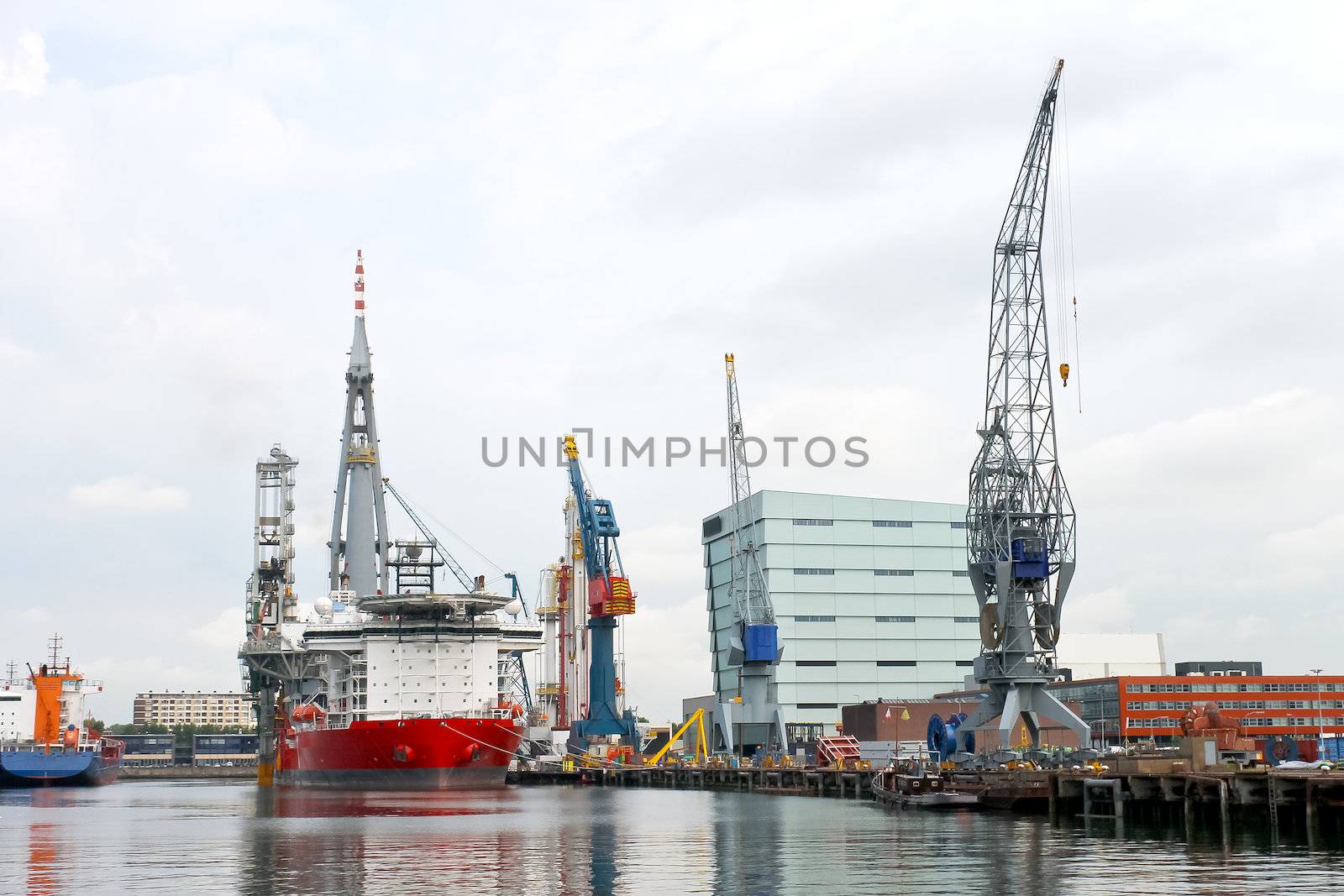 Industrial landscape. Ship and crane in shipyard by NickNick