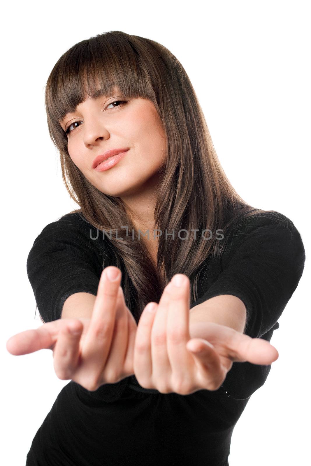 Playful young brunette posing in black dress and waving. Isolated on white