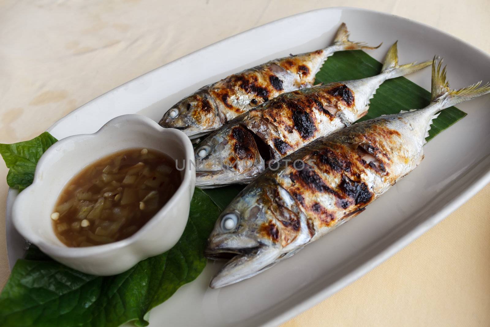 Grilled scomber fish with special fish sauce.