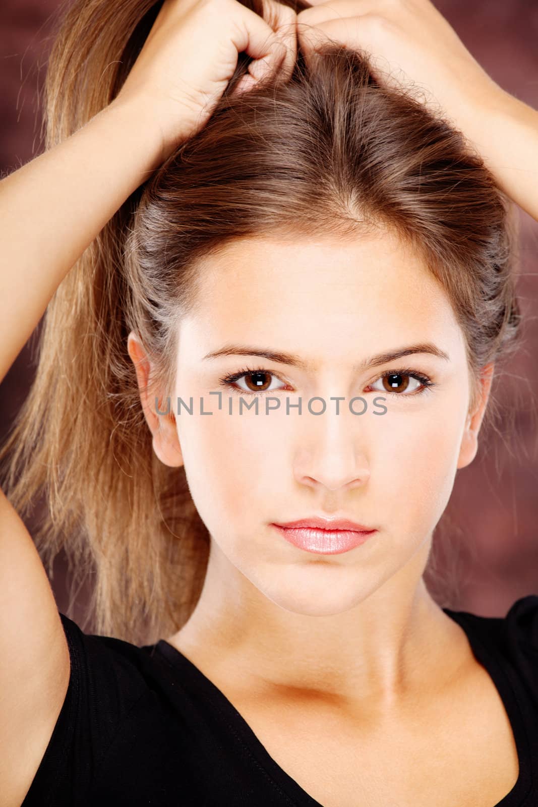 Pretty young woman on dark background