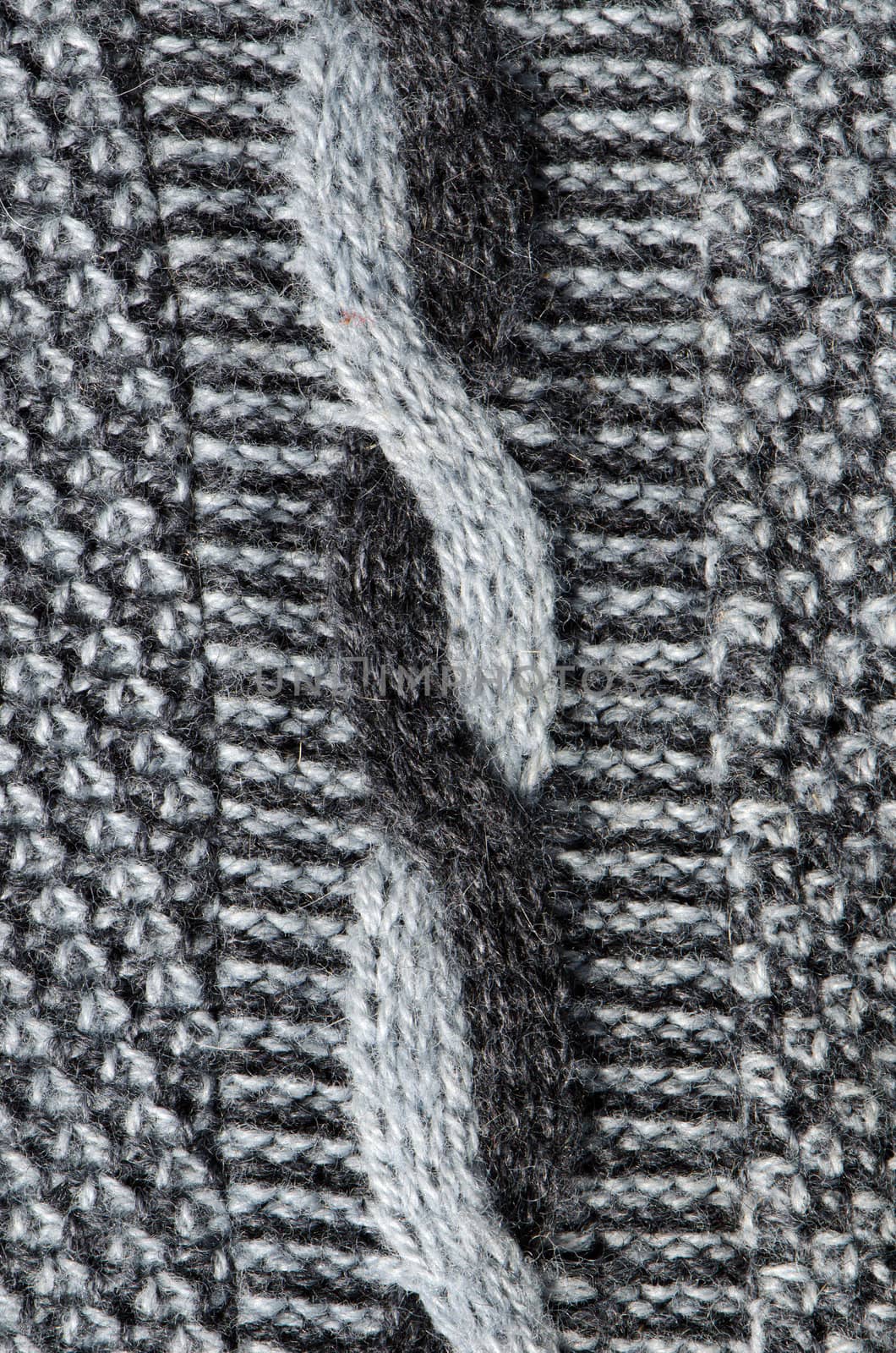 Interesting knit wool background of old handmade sweater pattern and material