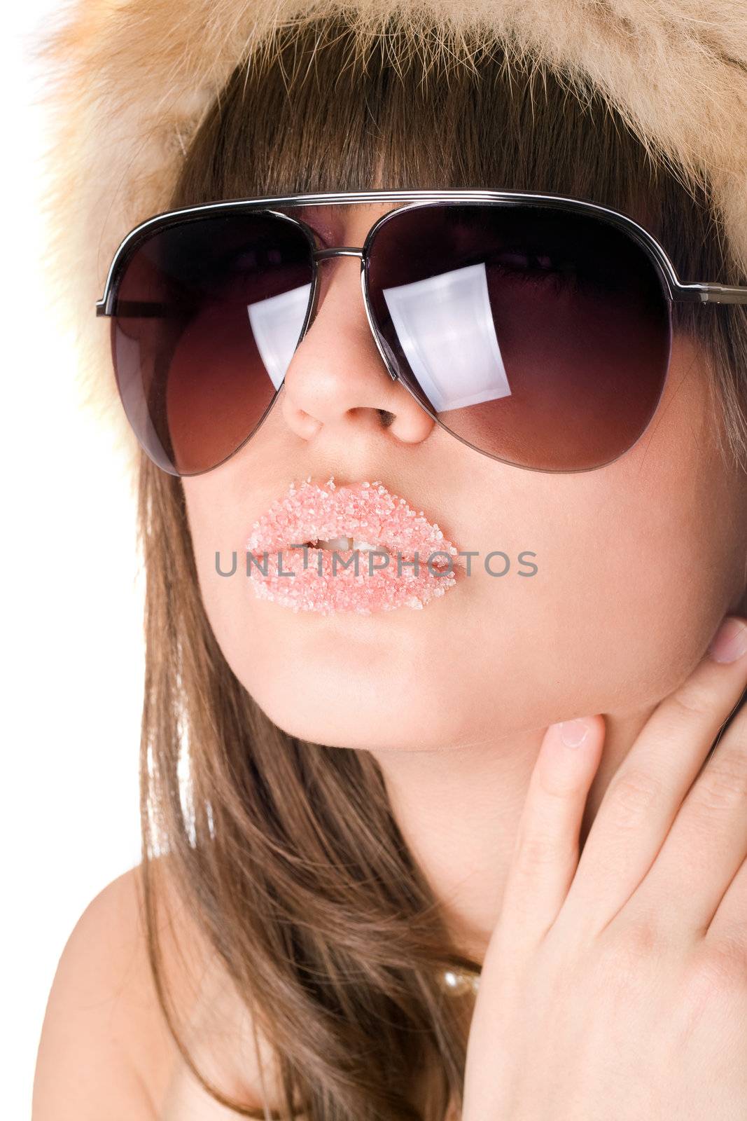 Close-up of sexy brunette with sugar lips. Isolated on white