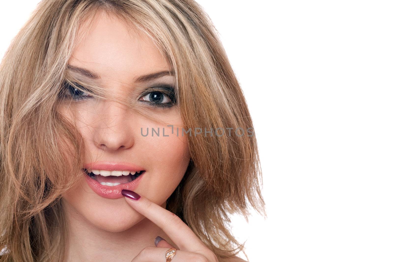Closeup portrait of smiling beautiful young blonde. Isolated