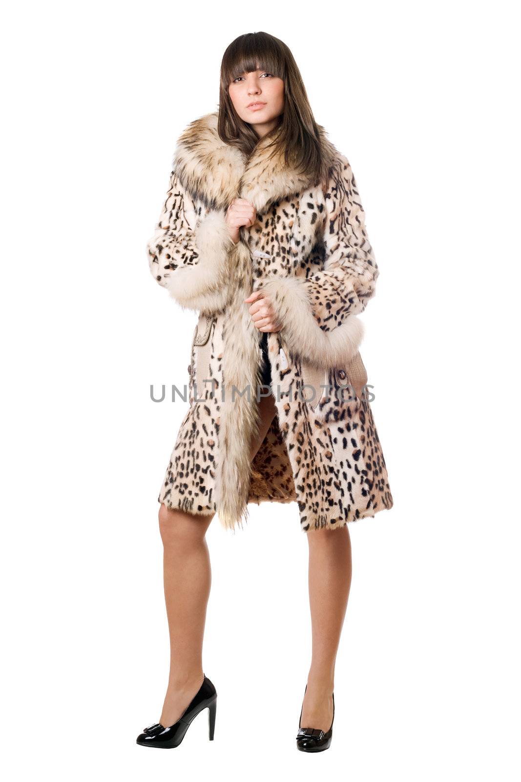 Young sexy lady in leopard coat. Isolated on white