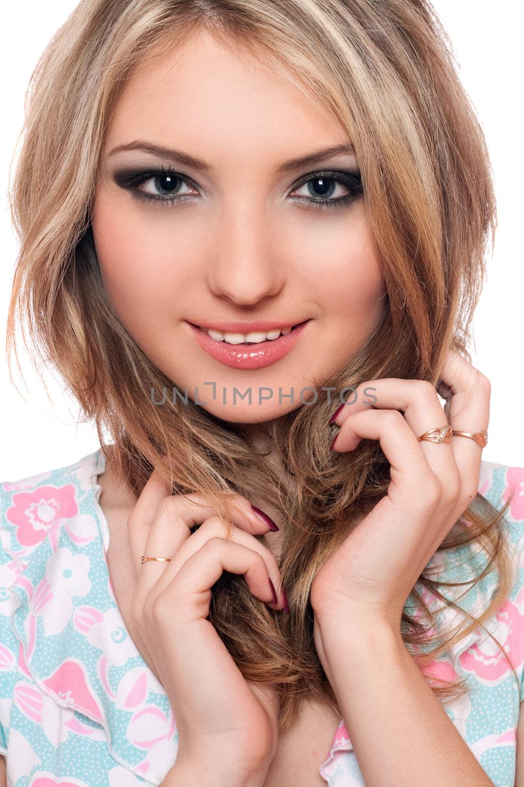 Closeup portrait of smiling young blonde. Isolated on white