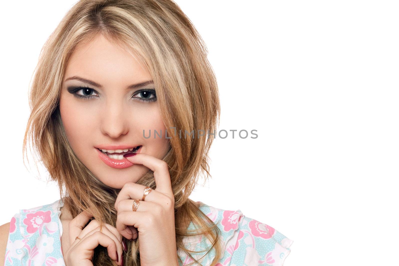 Closeup portrait of playful young blonde. Isolated on white