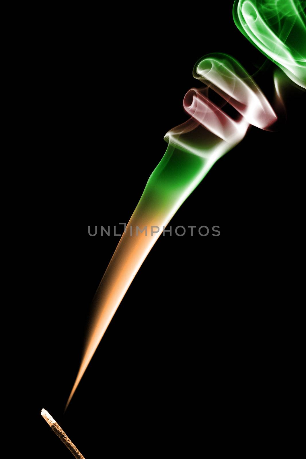 Stick with a color smoke. Isolated on black