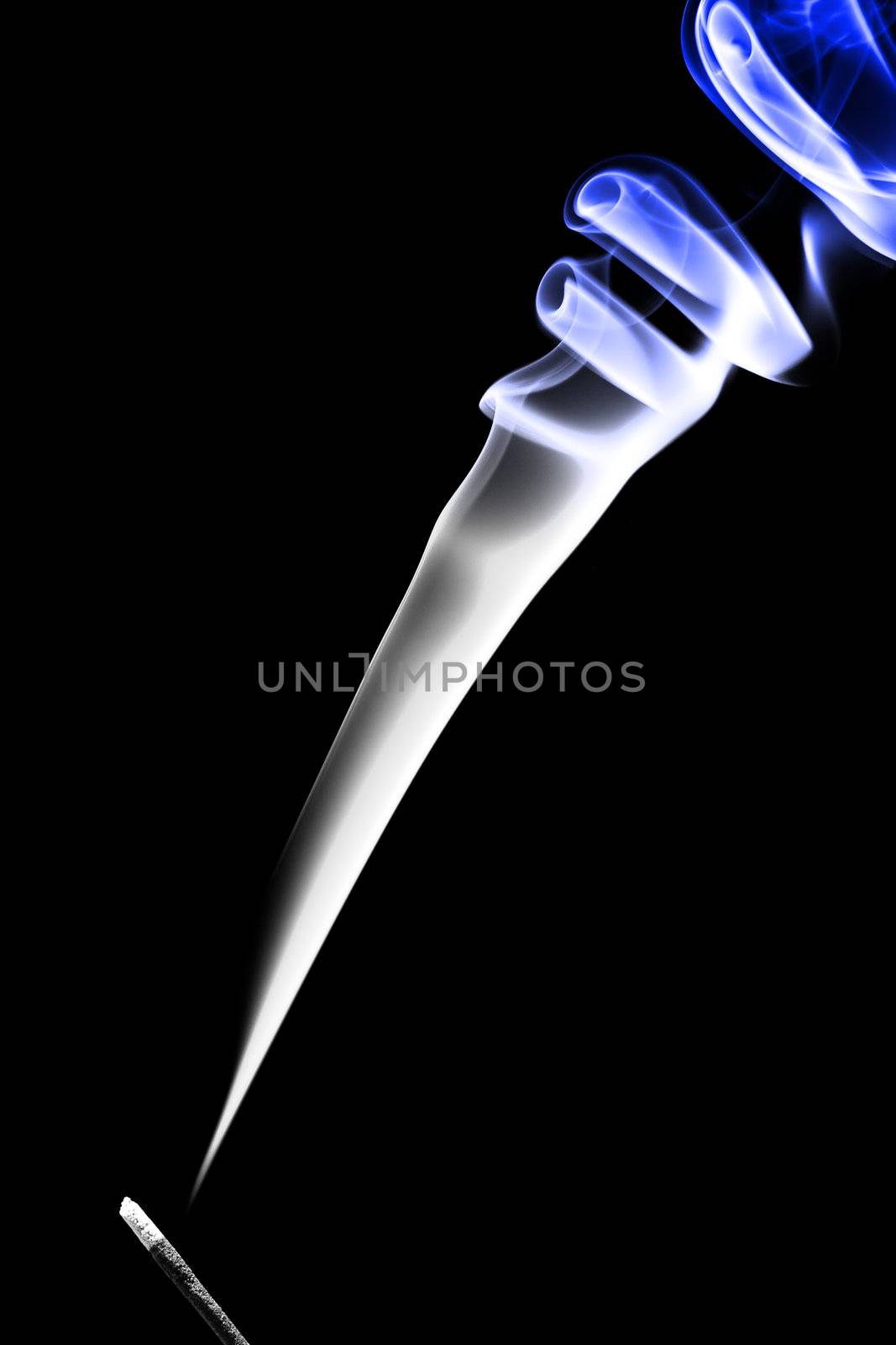 Stick with a blue smoke. Isolated on a black background