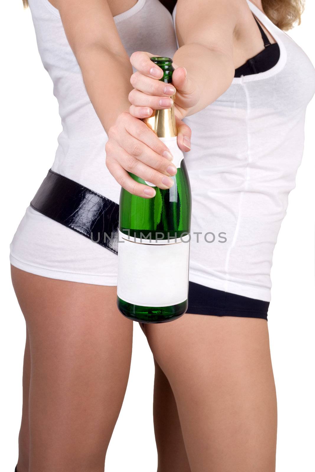 Two girls with a champagne bottle. Isolated