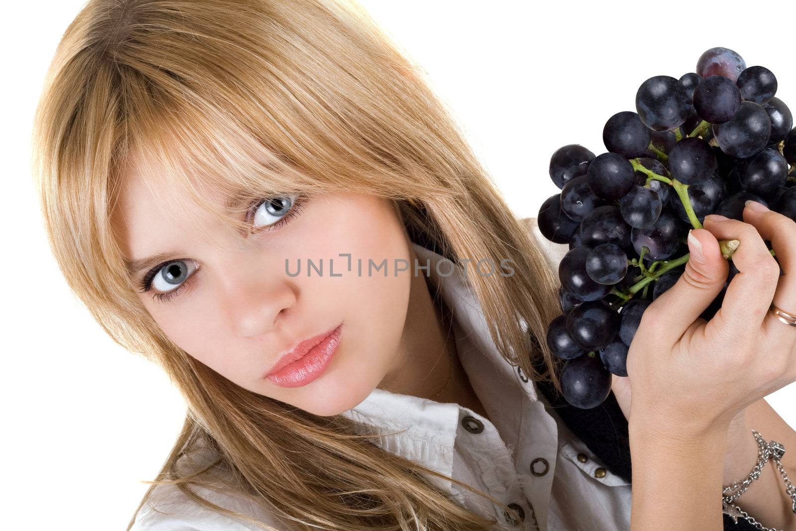 Portrait of the girl with grapes cluster. Isolated