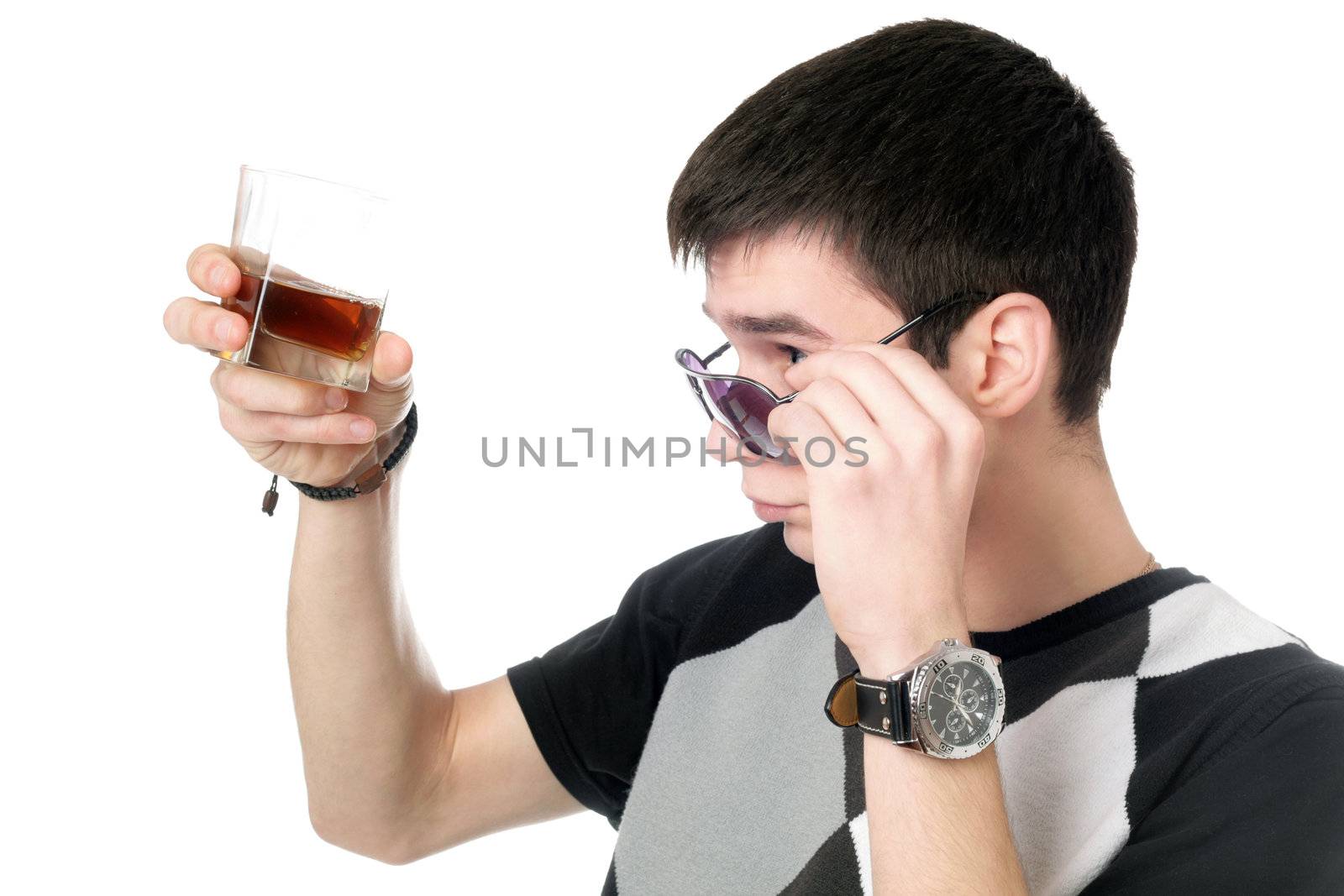 Young man with a glass of whiskey