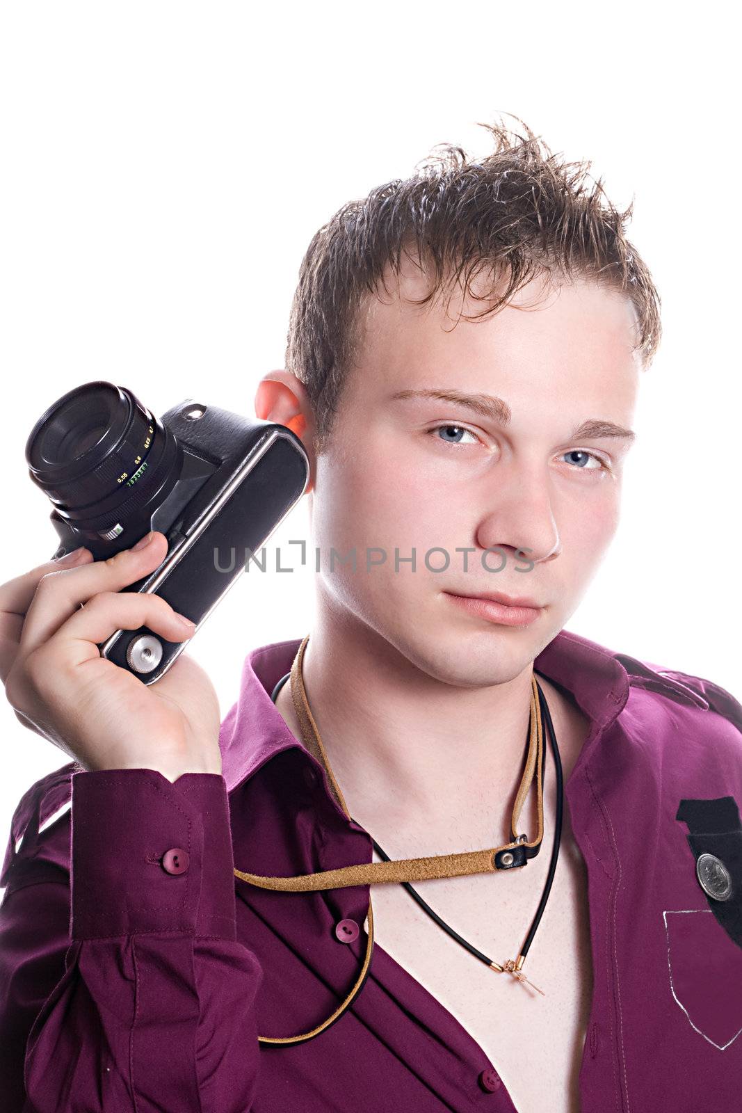 The young man with old camera. Isolated on white