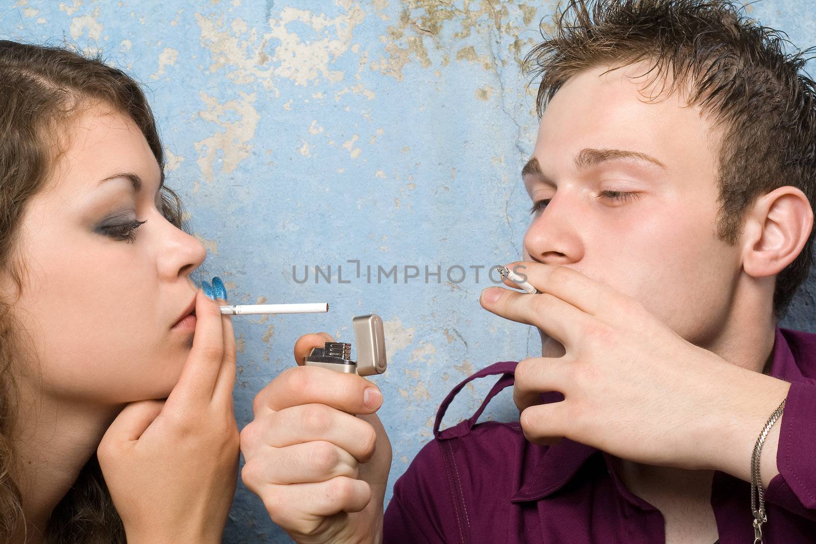 young couple with a cigarettes and a lighter 2