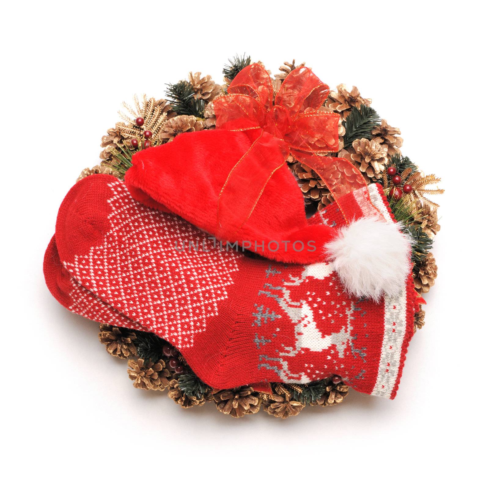 Traditional christmas wreath with santa hat an stocking isolated on white