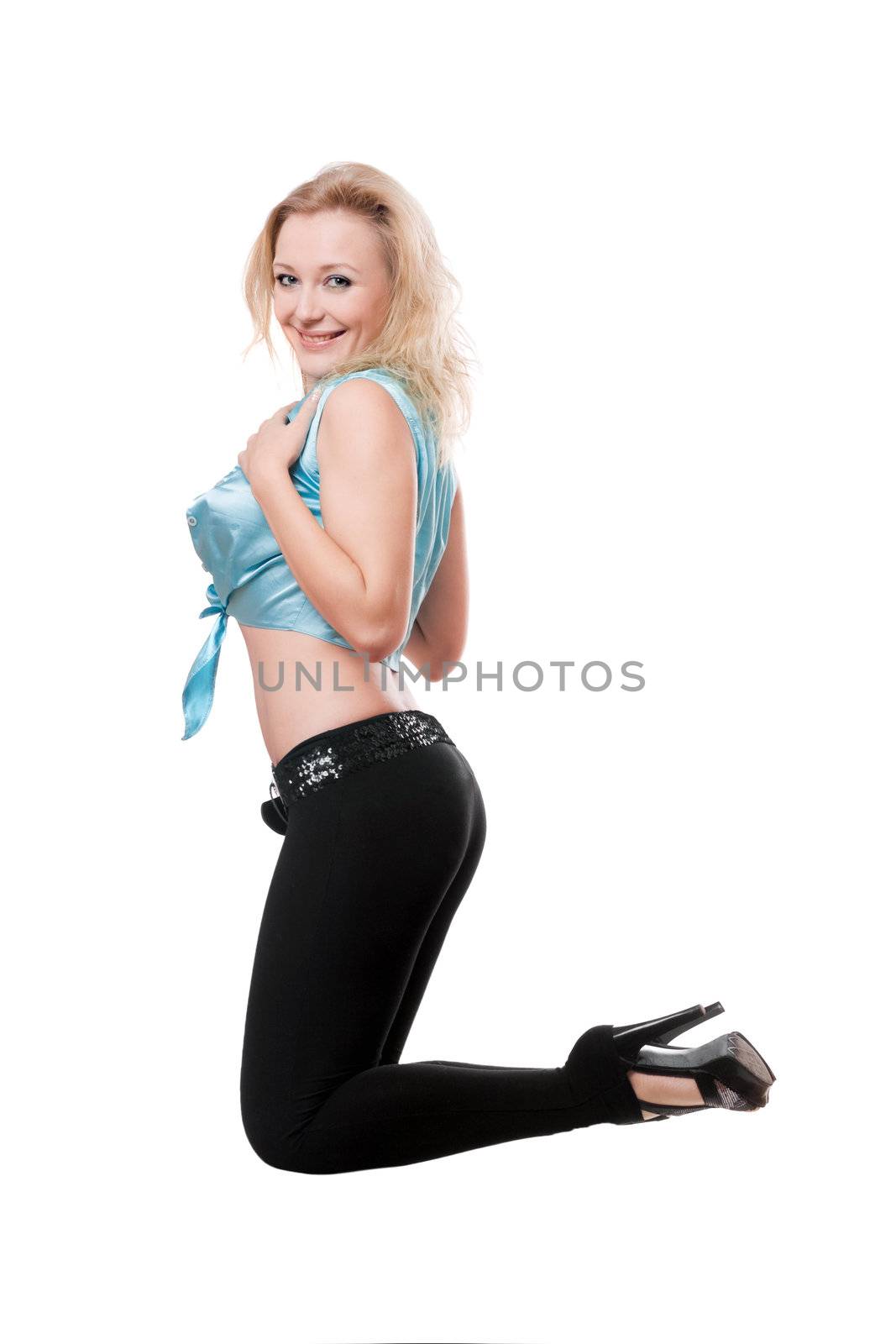 Cheerful attractive woman bending the knee. Isolated on white