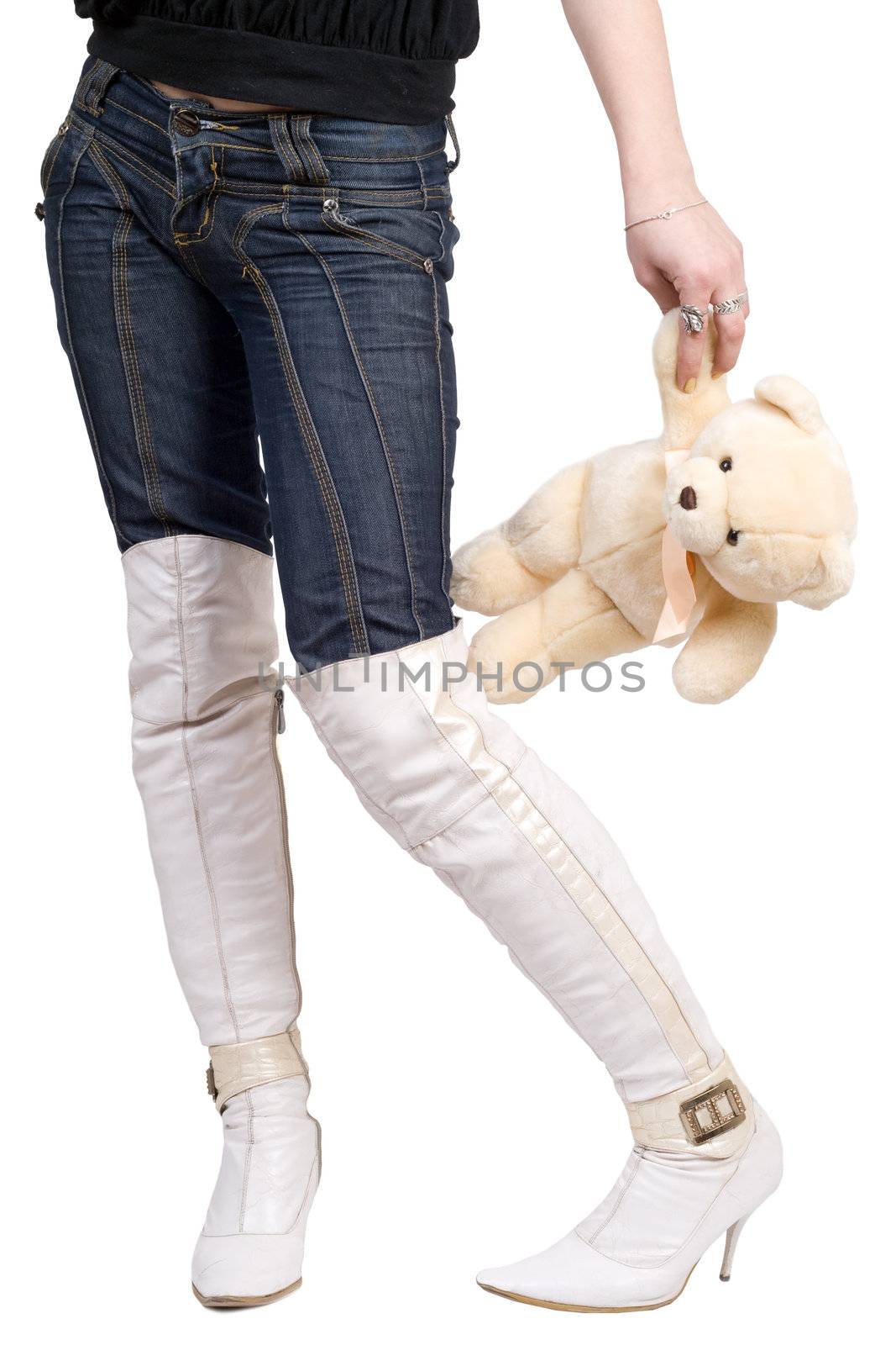 Woman taking a teddy bear in her hand. Isolated on white