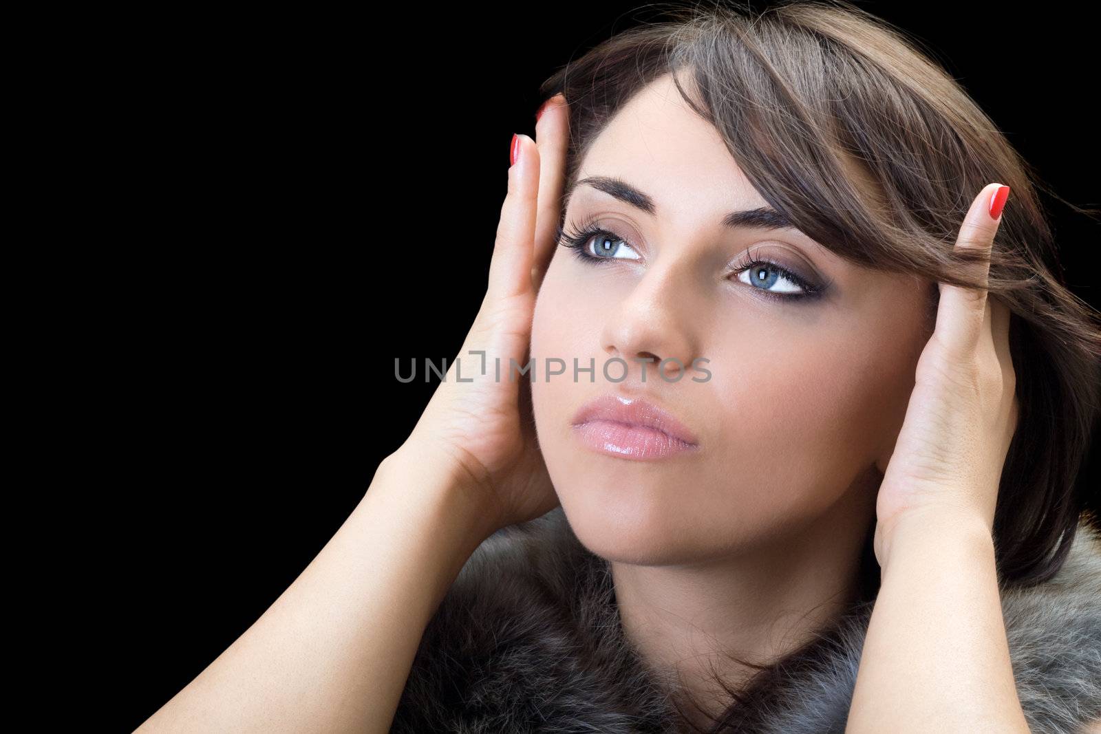 Portrait of thoughtful brunette. Isolated on black