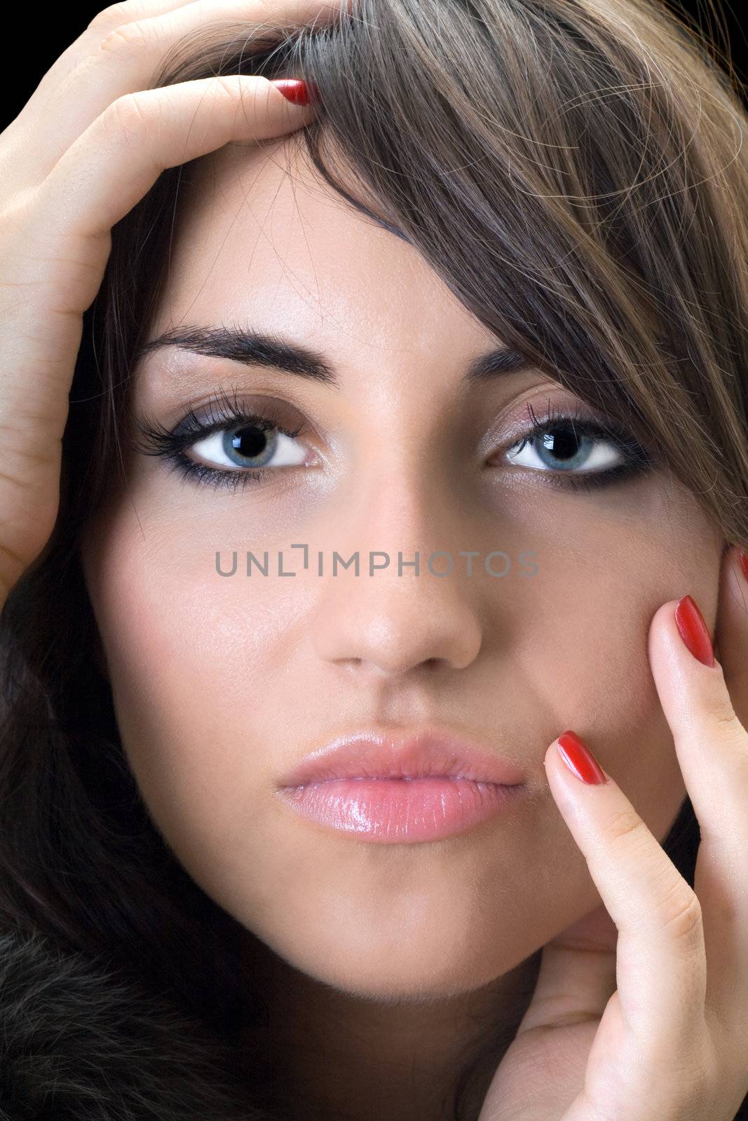 Portrait of beautiful young woman. Isolated on black
