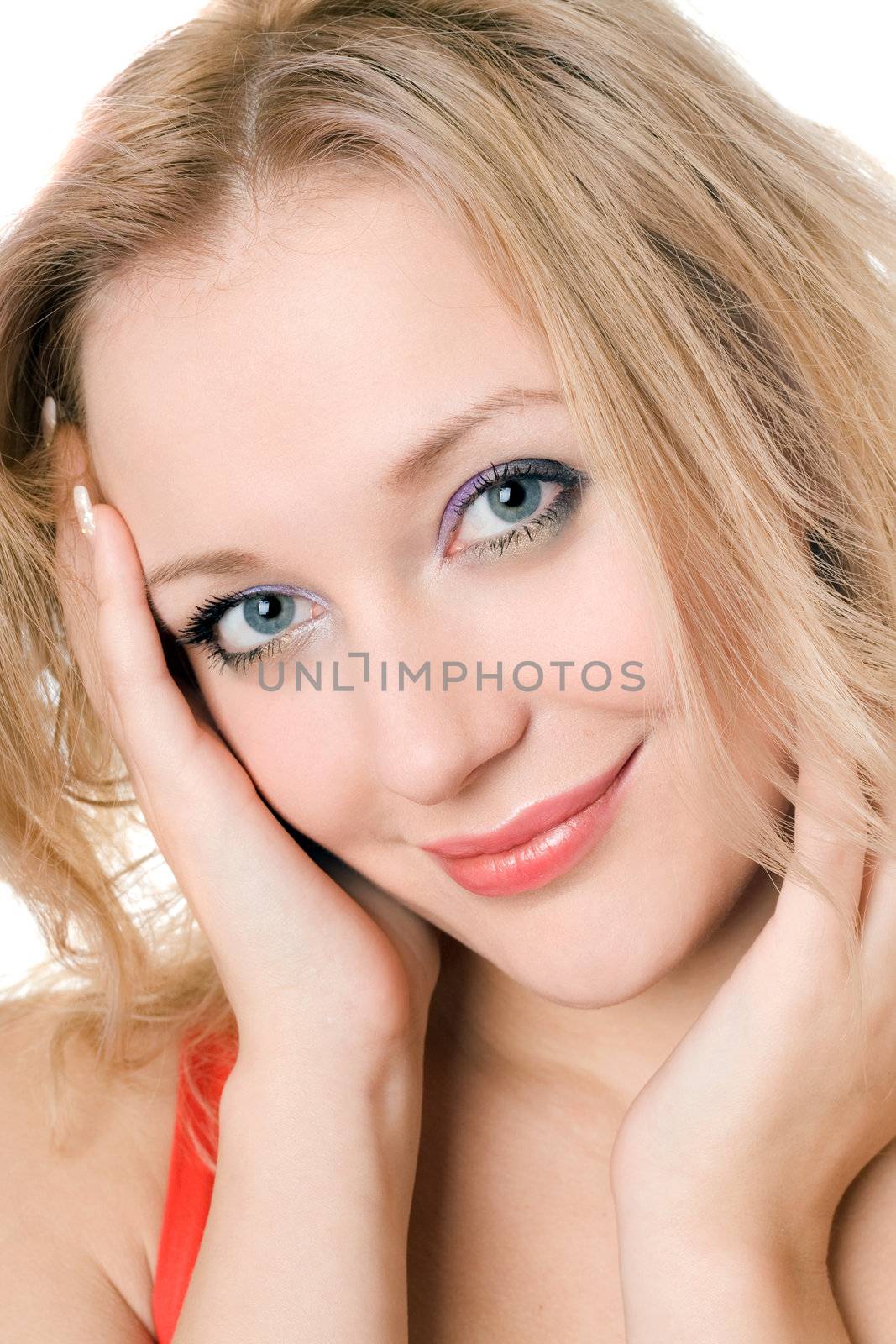 Portrait of young smiling blond woman. Isolated on white