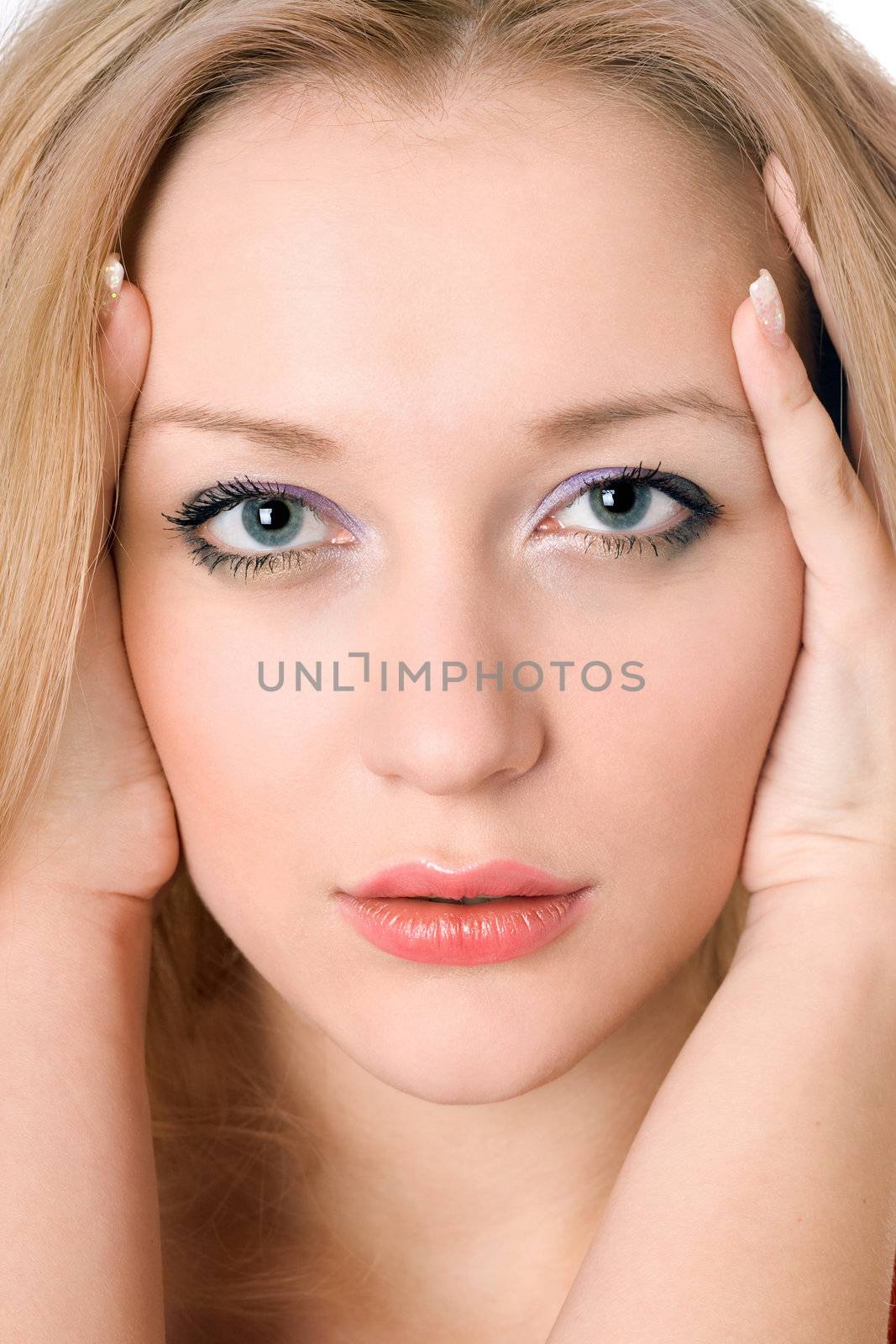 Portrait of young pretty blond woman. Isolated on white