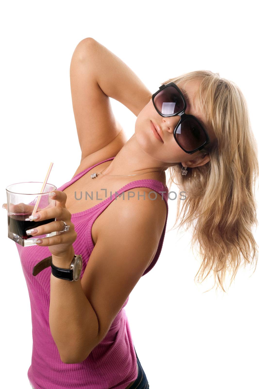 Pretty young woman posing with glass of drink. Isolated