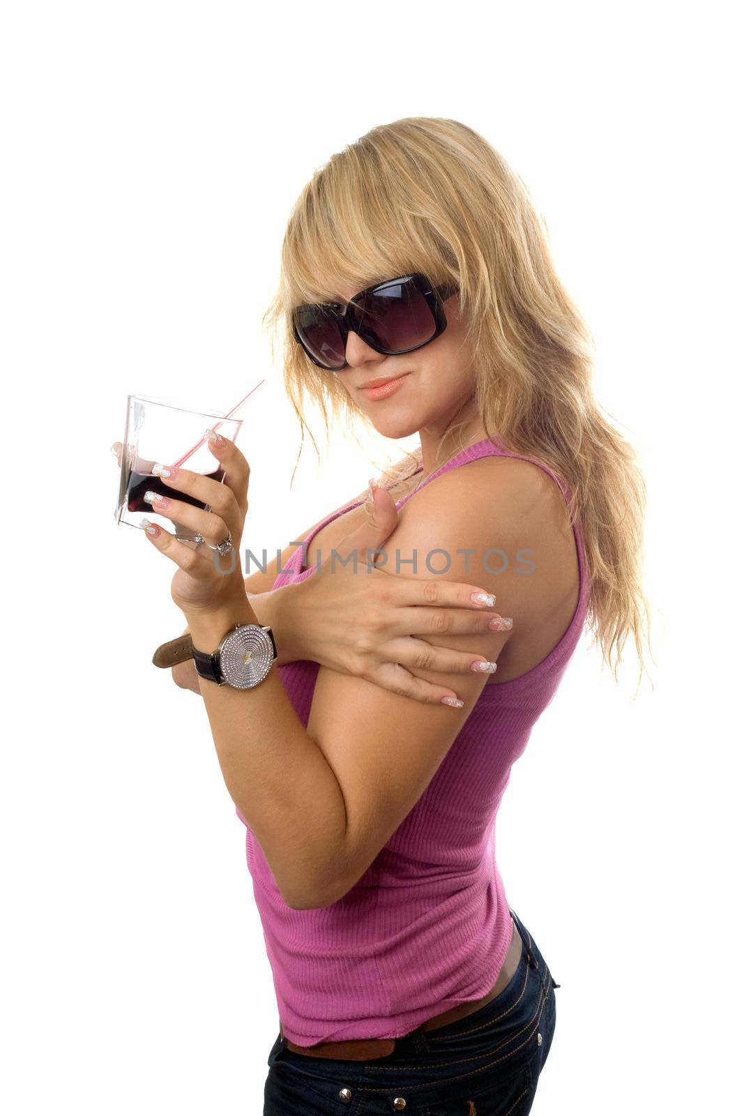 Playful young blonde with a glass of drink. Isolated