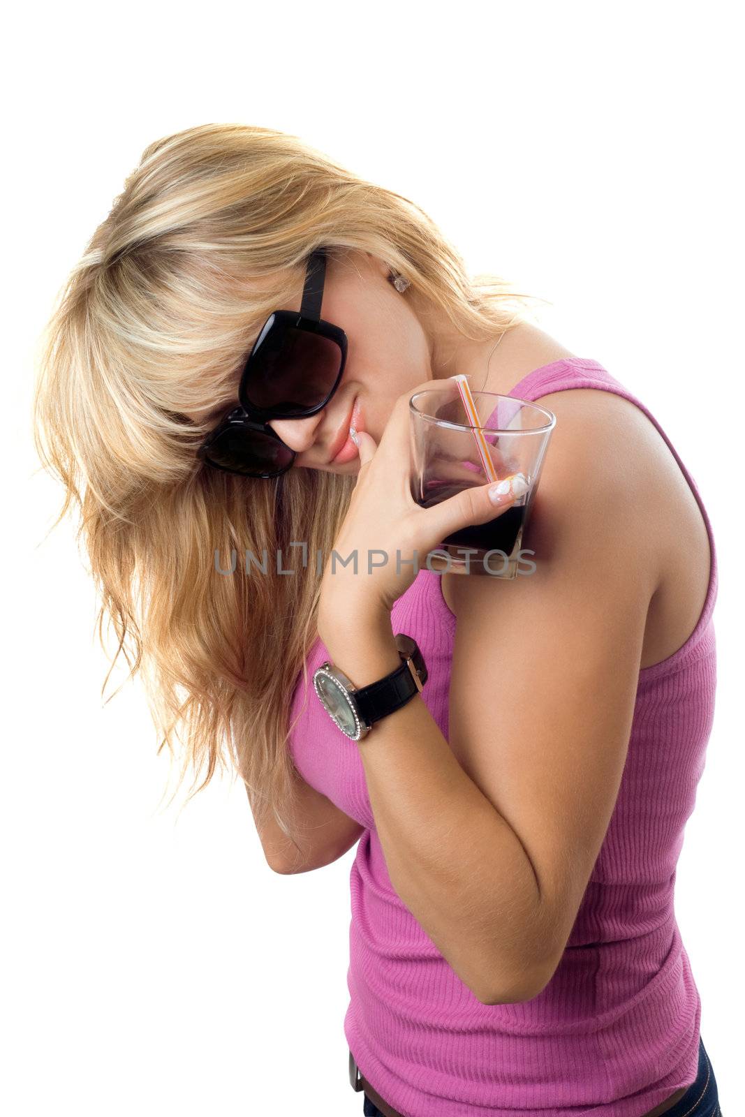 Playful sexy blonde with a glass of drink. Isolated on white