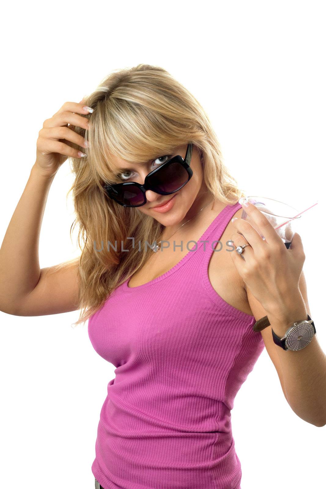 Playful sexy blonde posing with a glass of drink. Isolated