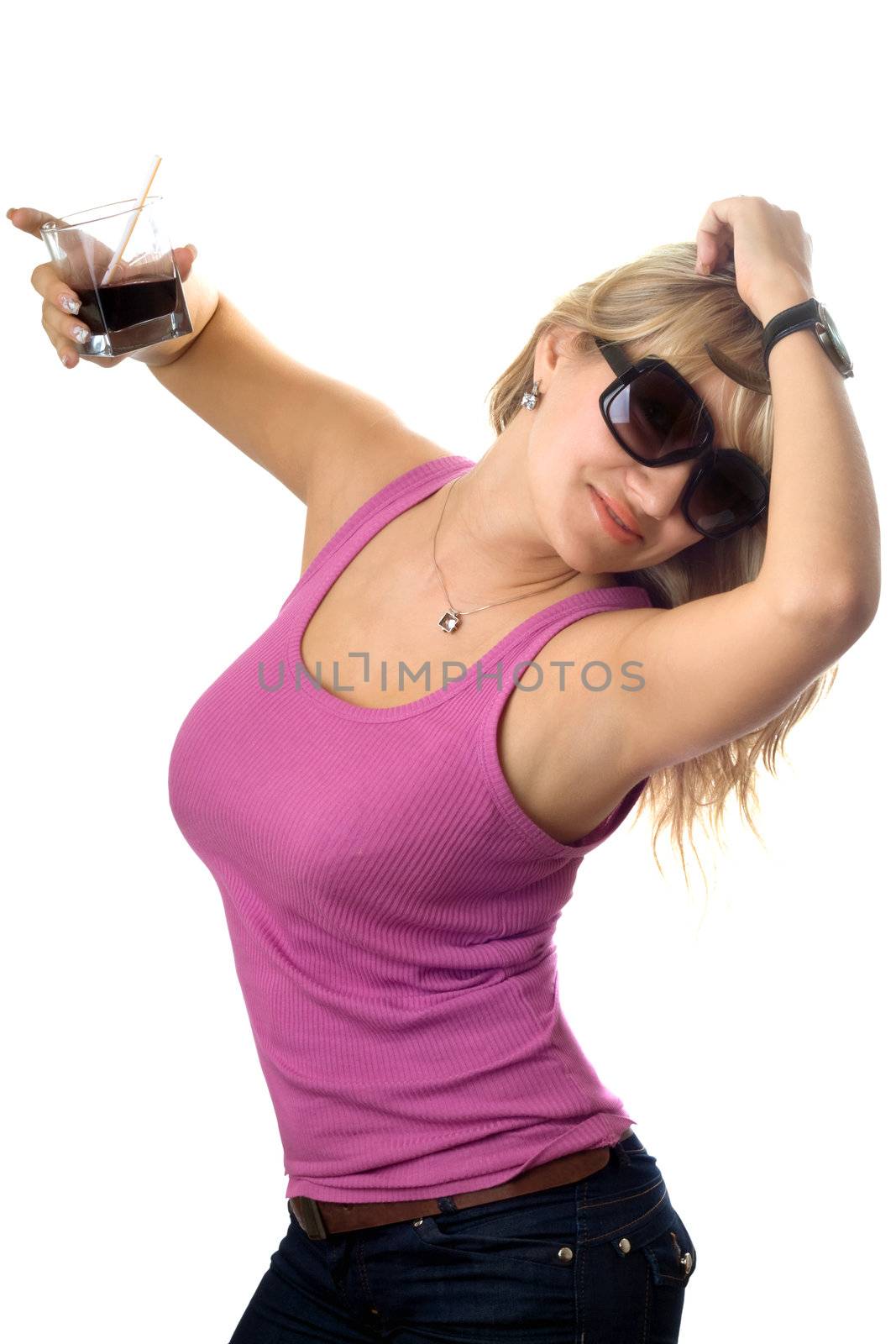Playful sexy blonde dancing with a glass of drink. Isolated