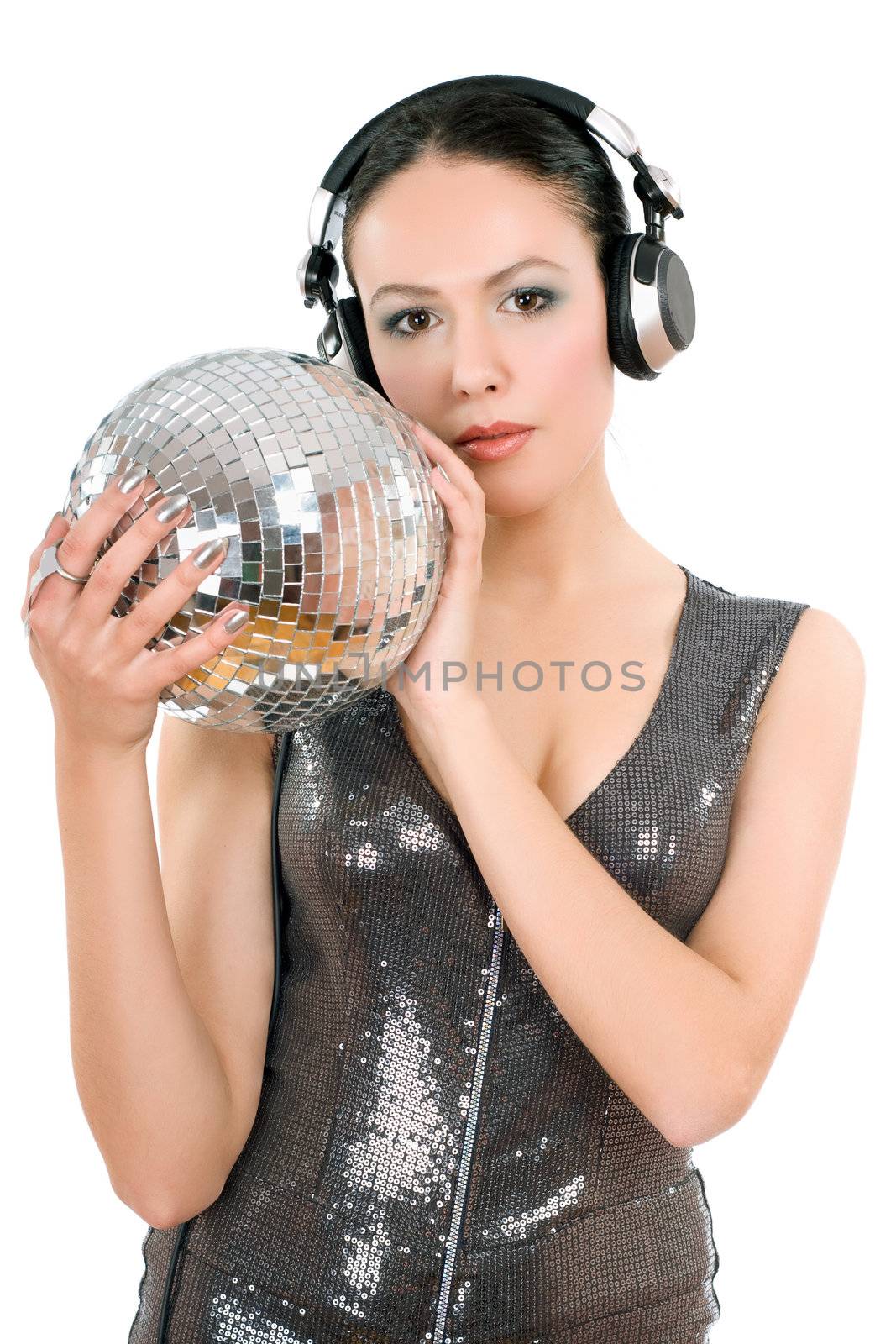 Sexy young woman in headphones with a mirror ball. Isolated on white