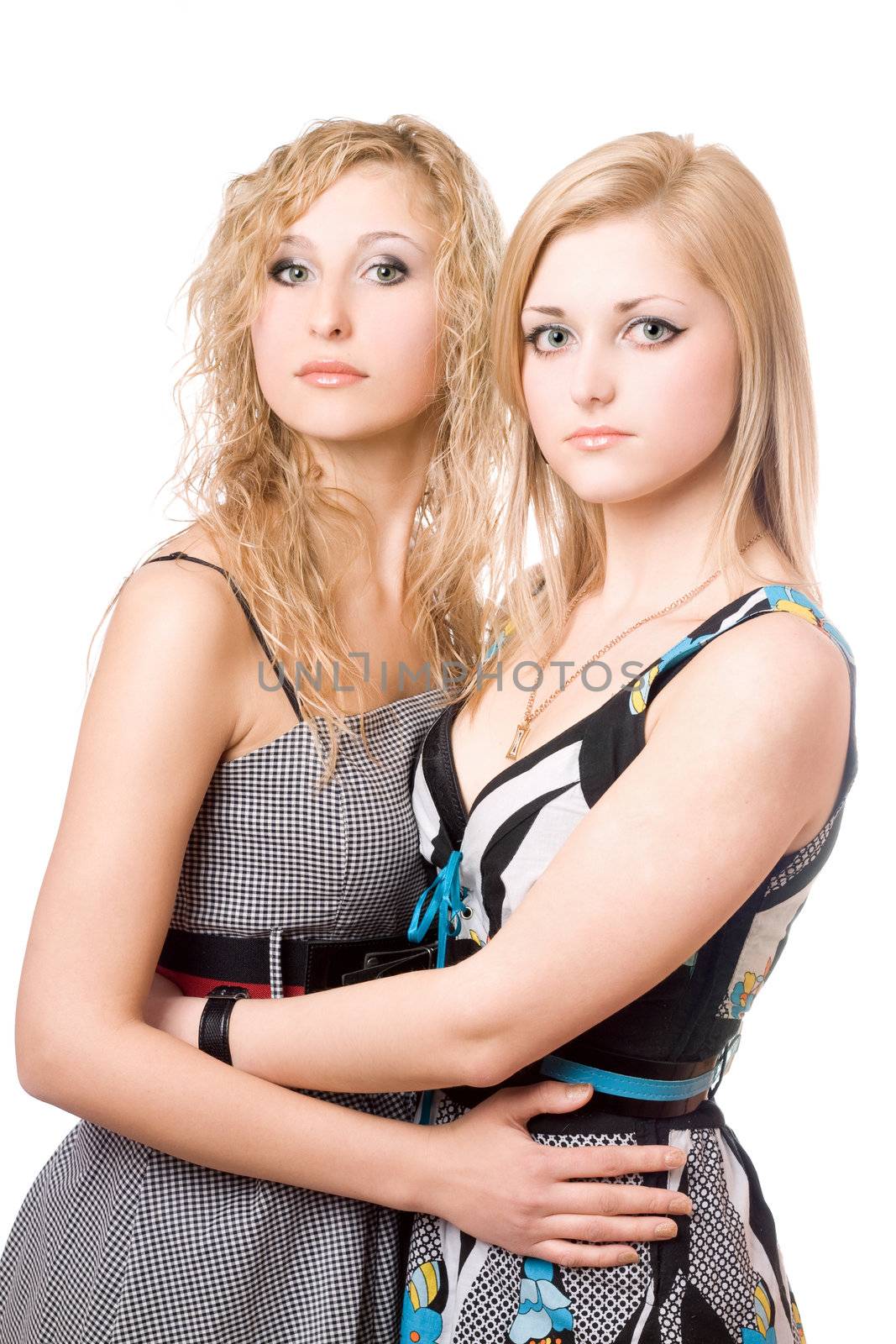 Portrait of two pretty young women. Isolated