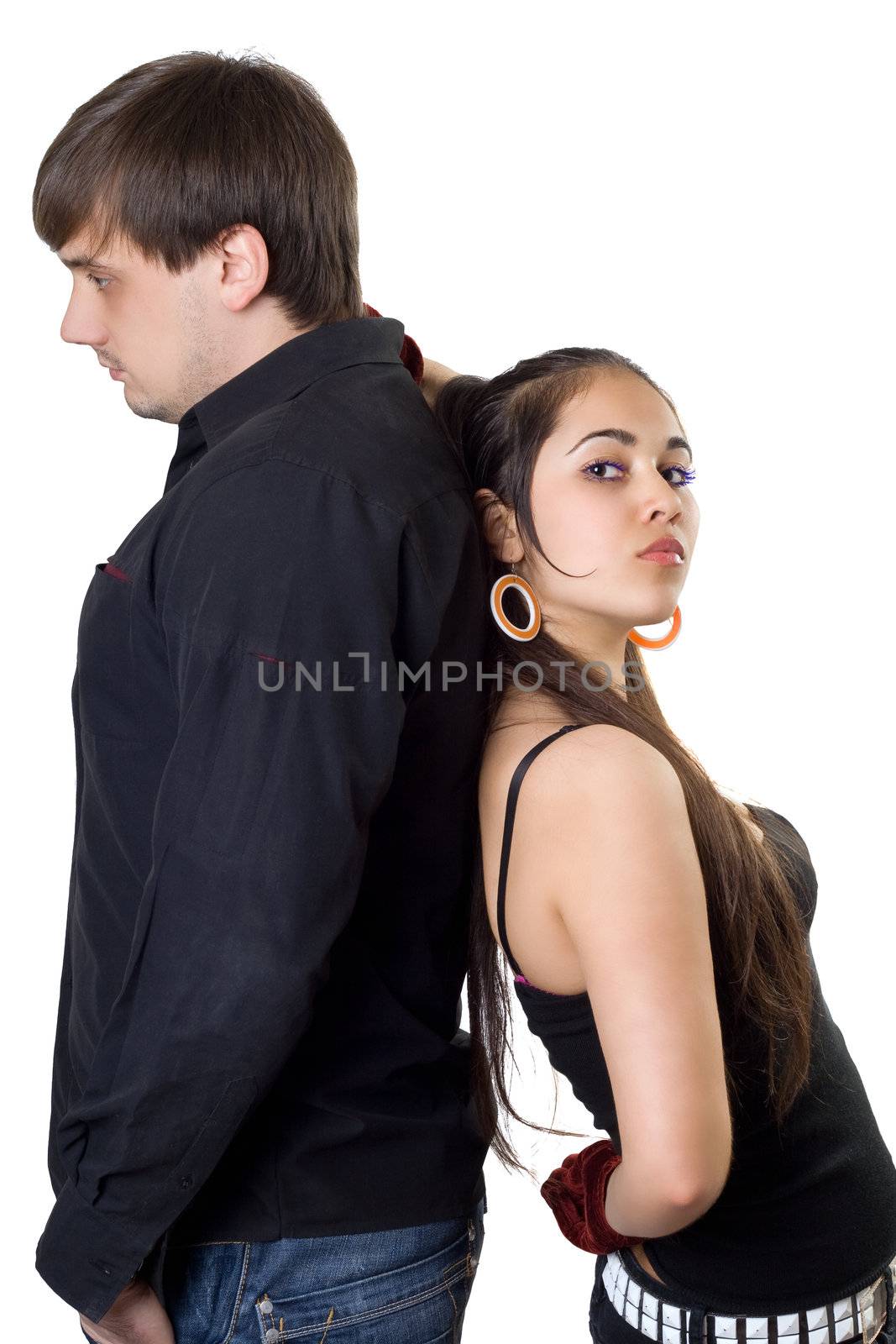 Young man and woman standing back-to-back. Isolated