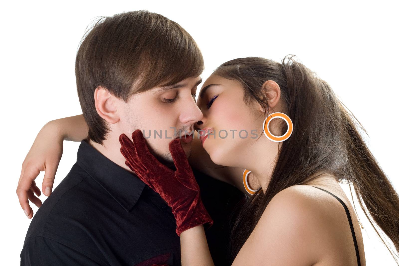 Portrait of young kissing couple. Isolated on white