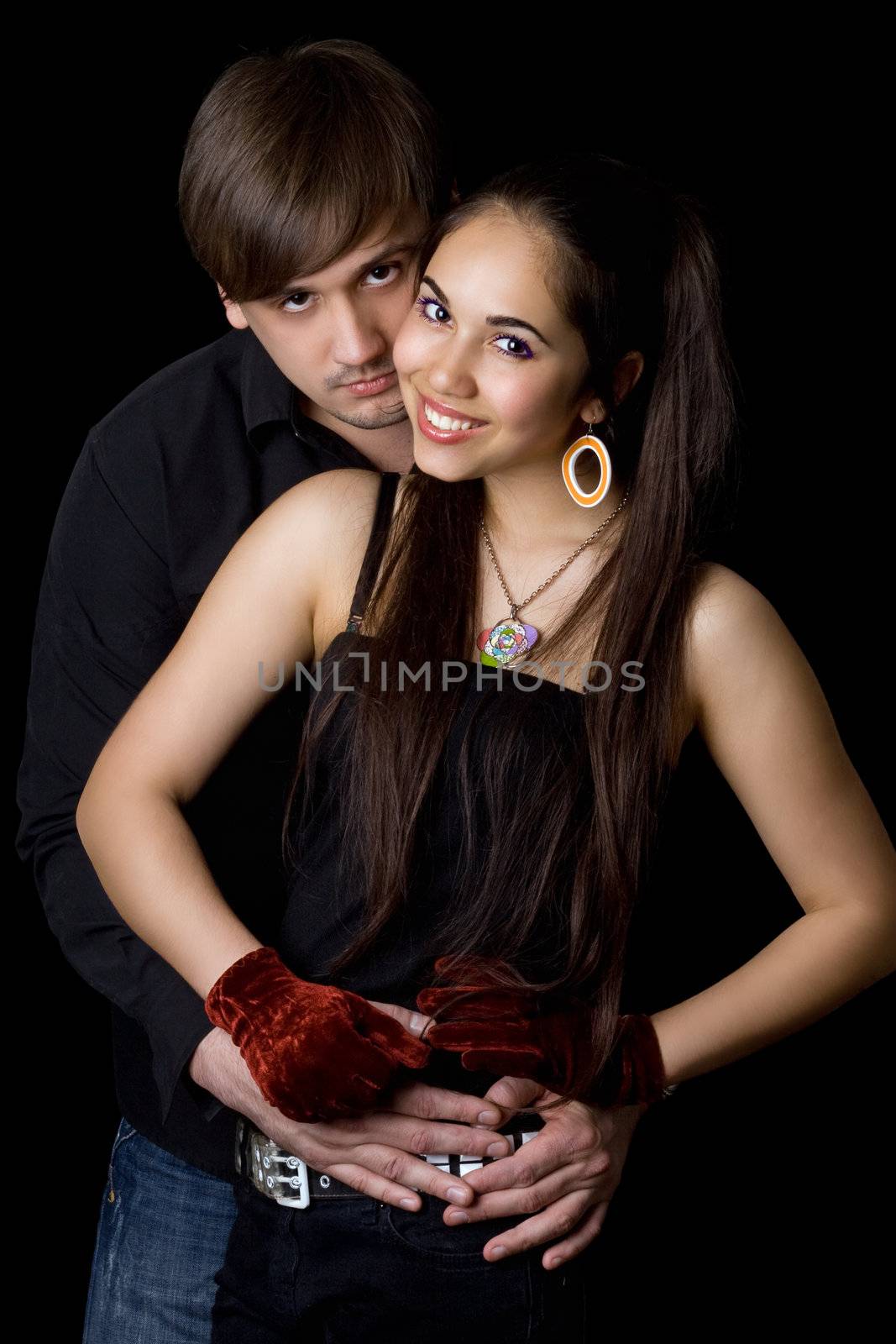 Portrait of lovely couple hugging one another. Isolated