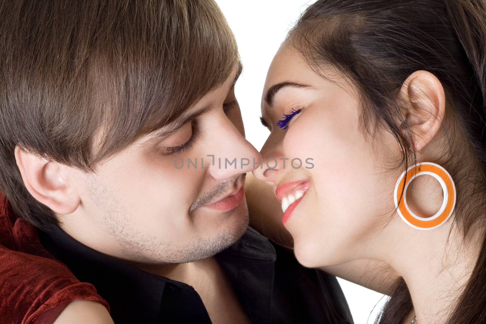 Portrait of the beautiful young couple. Isolated