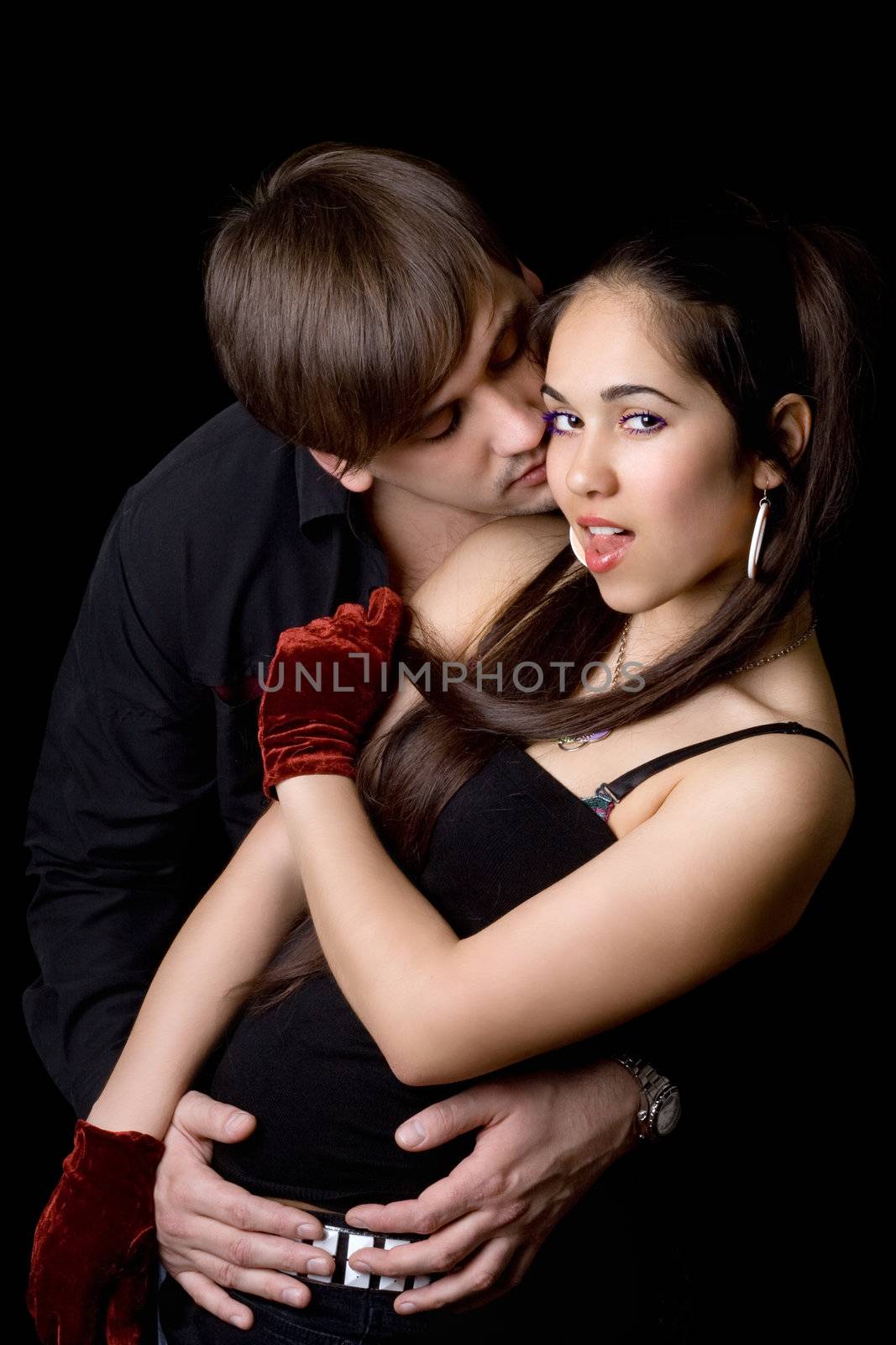 Young man taking pretty woman in his hands. Isolated