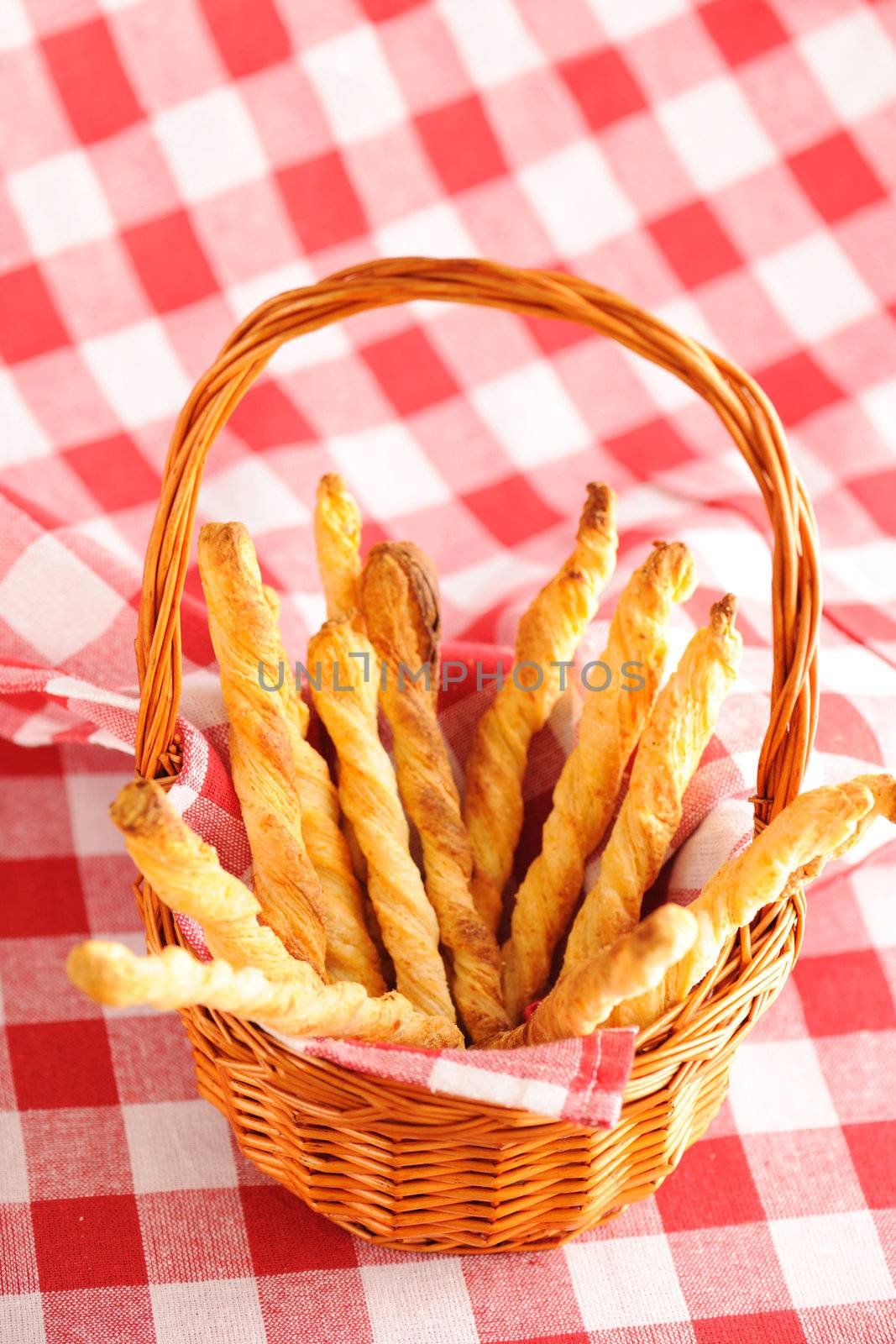Cheese twists pastry over red cloth
