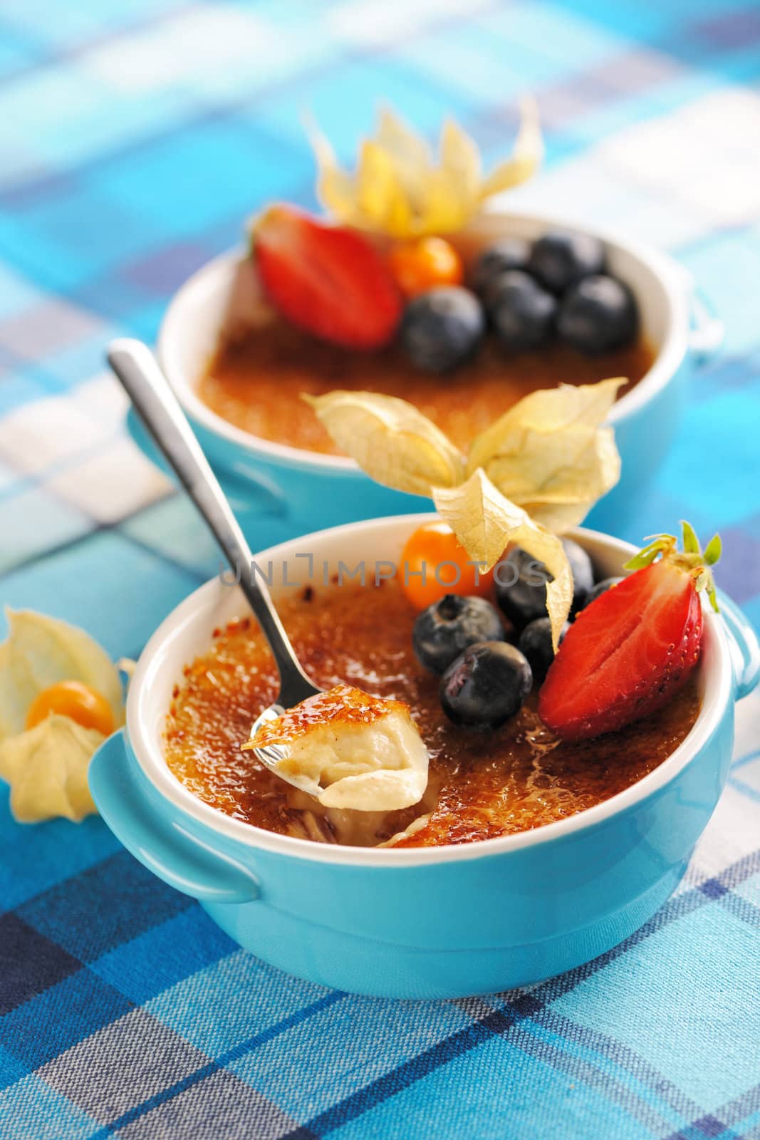 Creme brulee (cream brulee, burnt cream) with fruits and berries