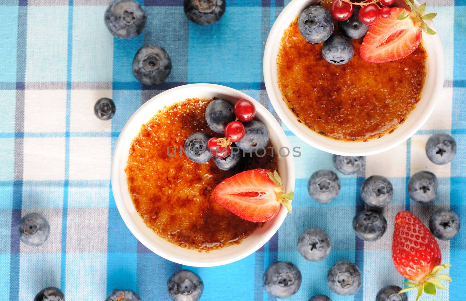 Creme brulee (cream brulee, burnt cream) with fruits and berries