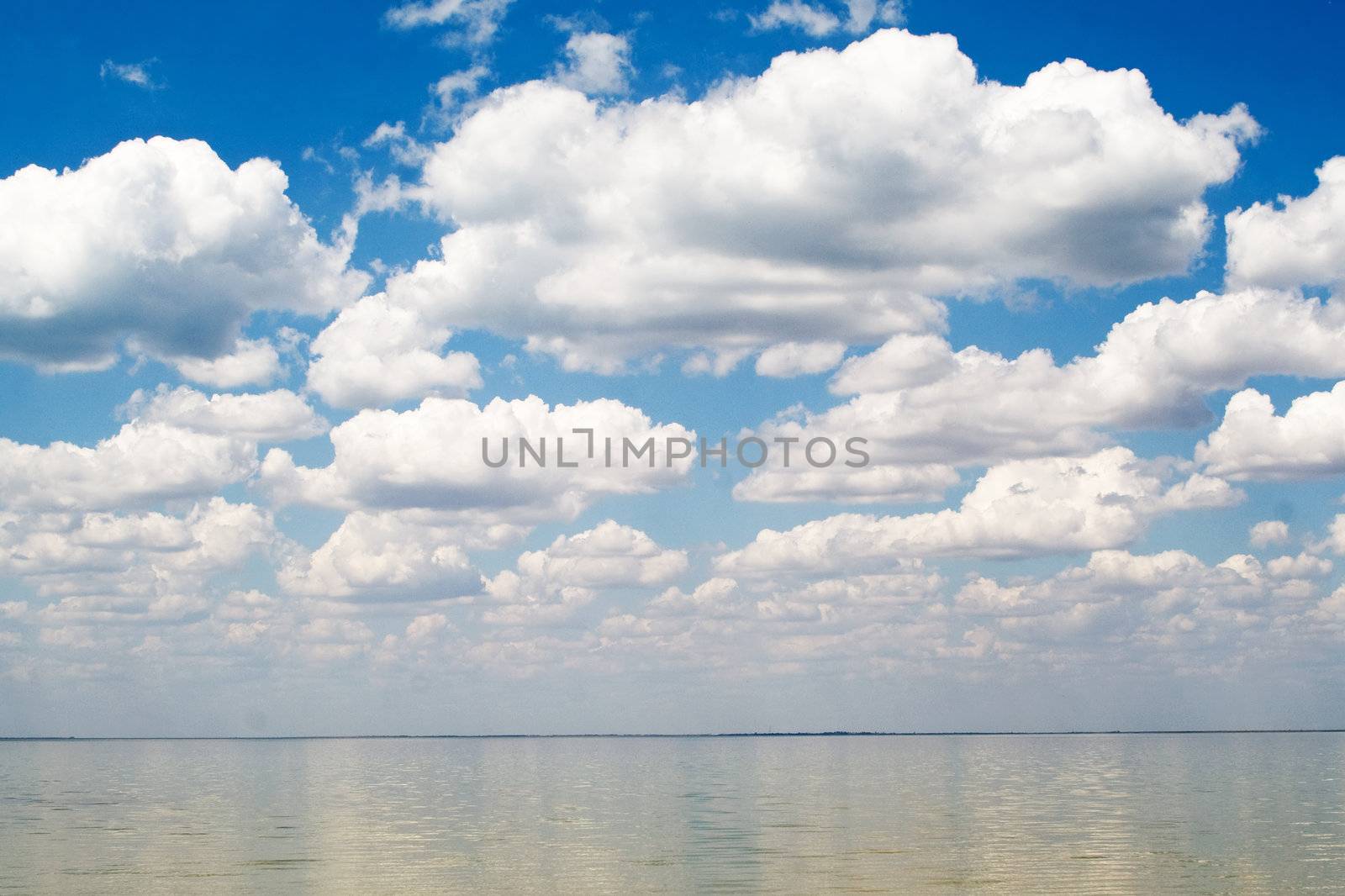 The blue sky and clouds over a bay